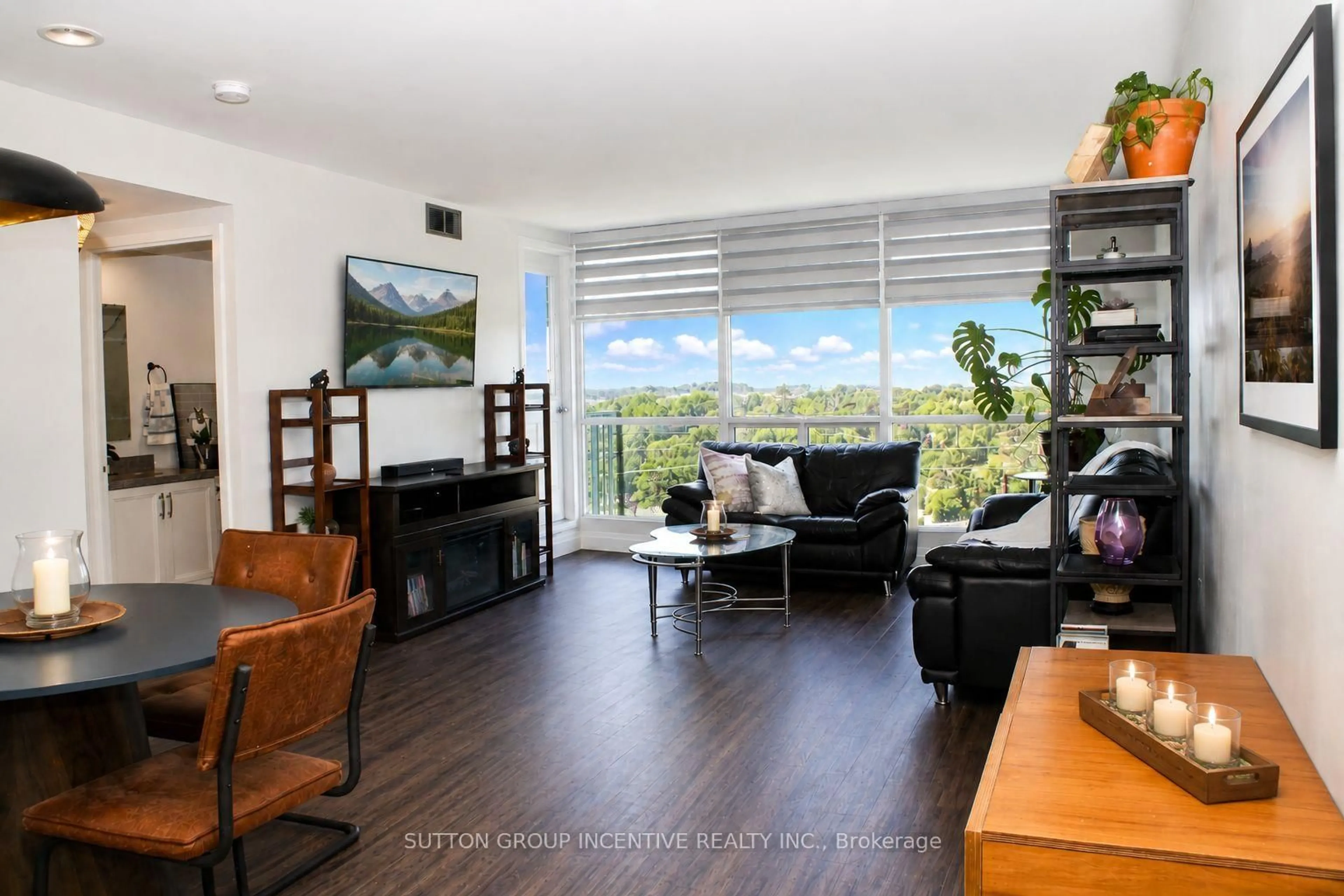 Living room with furniture, wood/laminate floor for 65 Ellen St #708, Barrie Ontario L4N 3A5