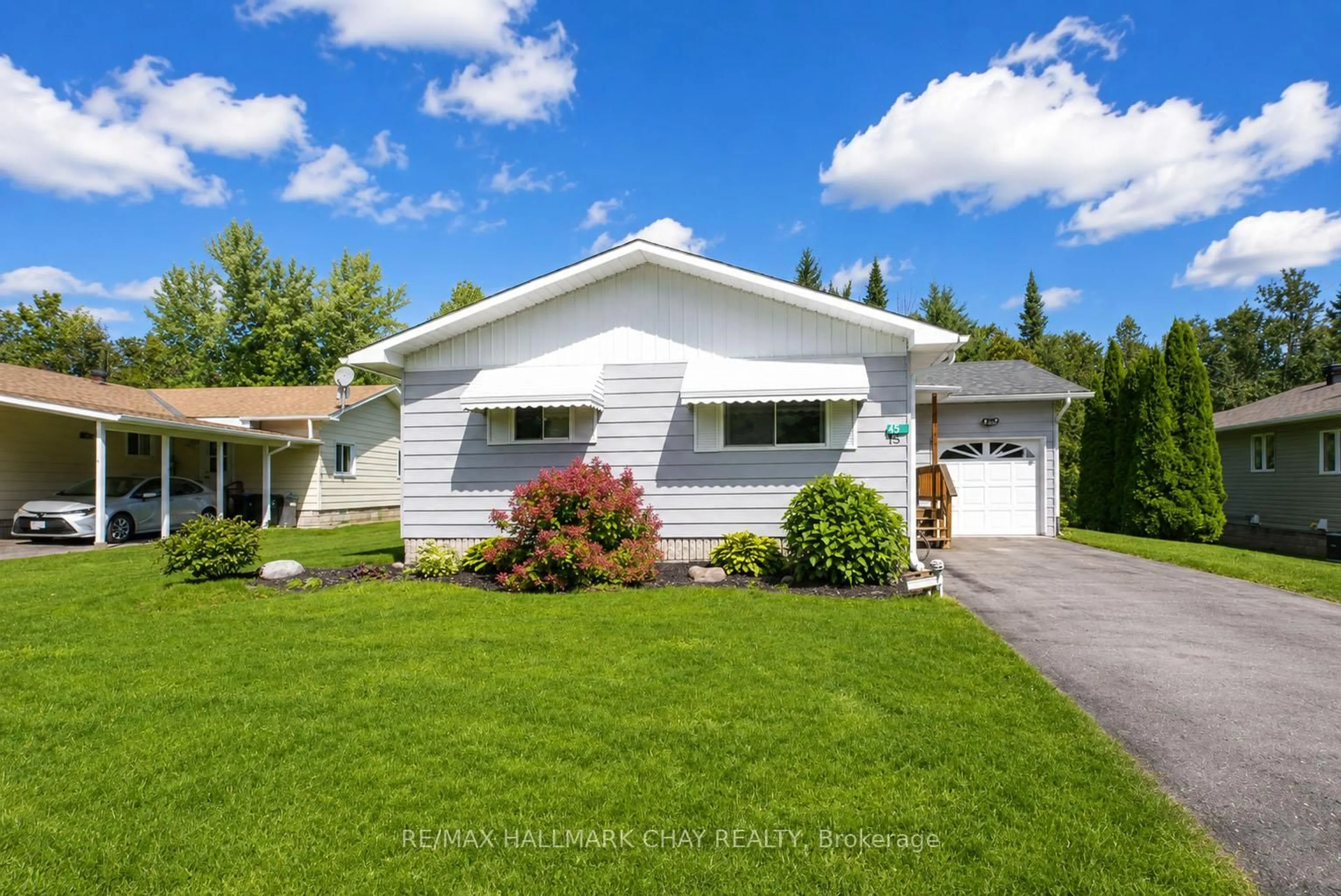 Home with vinyl exterior material, street for 45 Tamarack Dr, Oro-Medonte Ontario L0L 1T0
