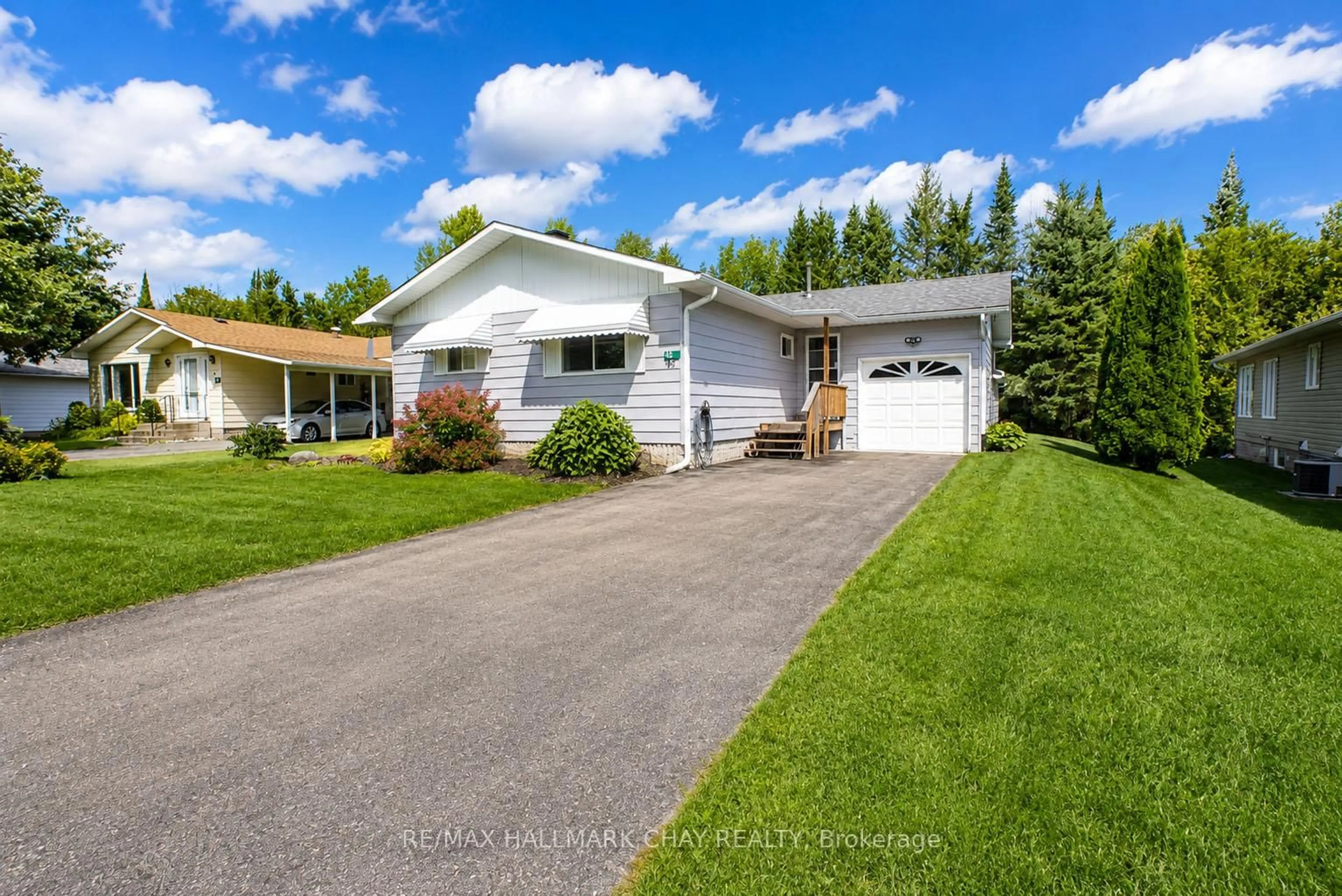 Home with vinyl exterior material, street for 45 Tamarack Dr, Oro-Medonte Ontario L0L 1T0