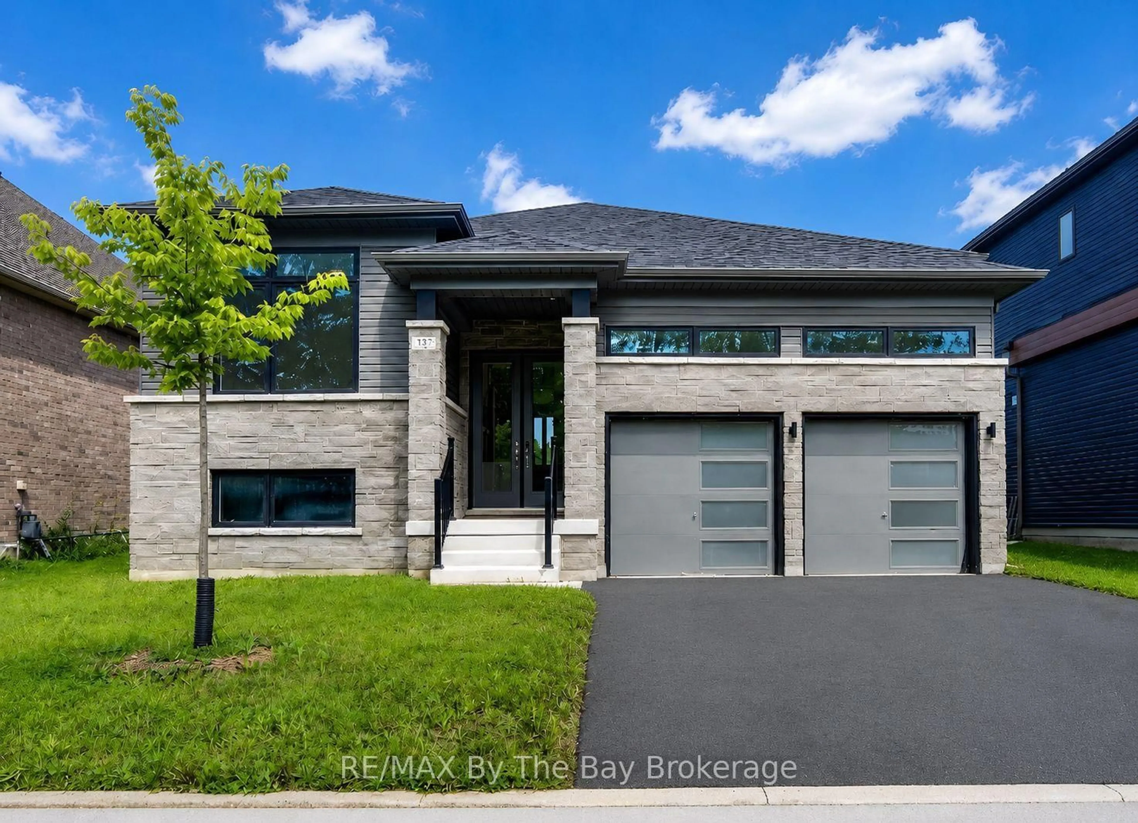 Home with brick exterior material, street for 232 Ramblewood Dr, Wasaga Beach Ontario L9Z 0L6