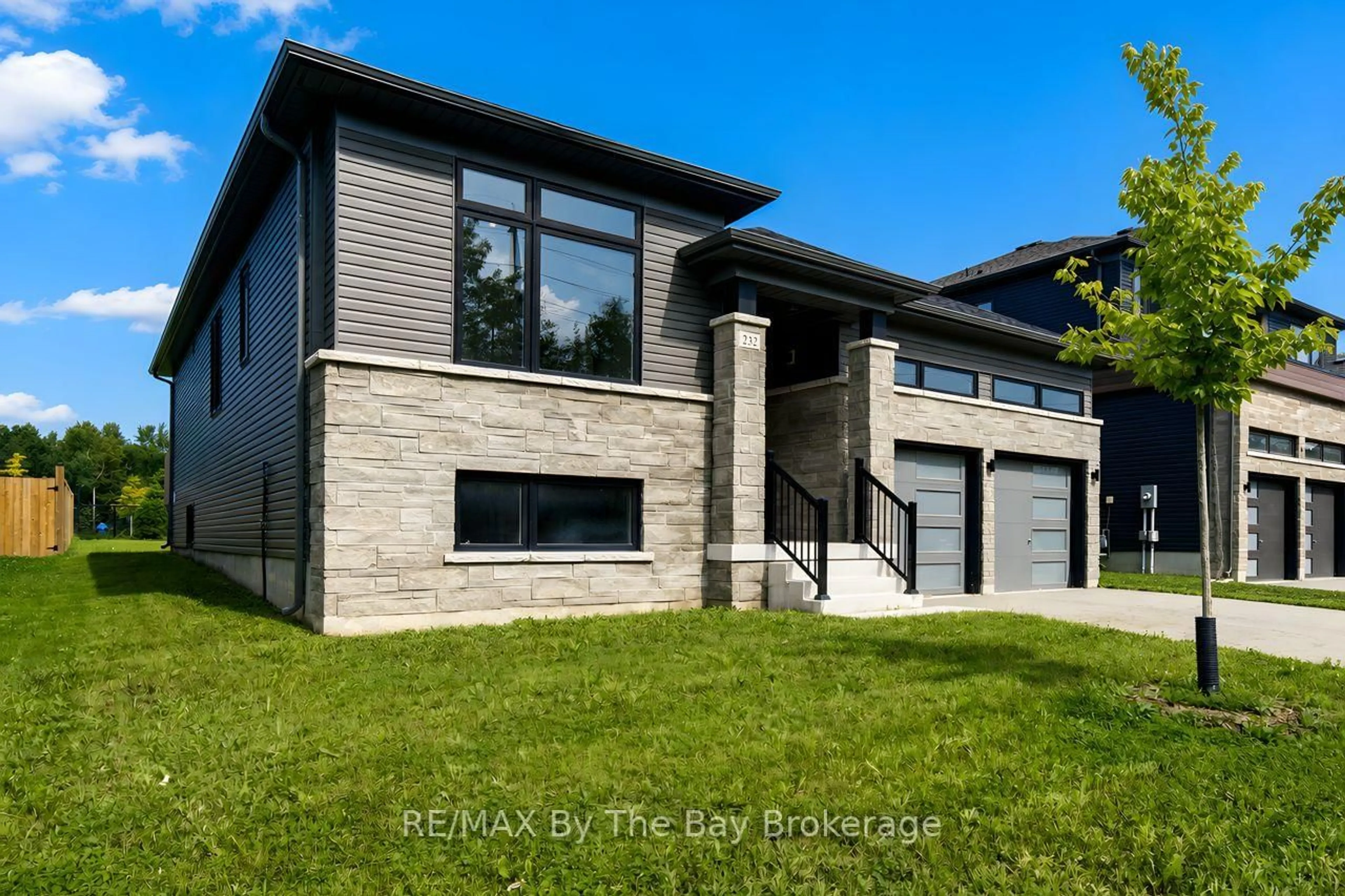 Home with brick exterior material, street for 232 Ramblewood Dr, Wasaga Beach Ontario L9Z 0L6
