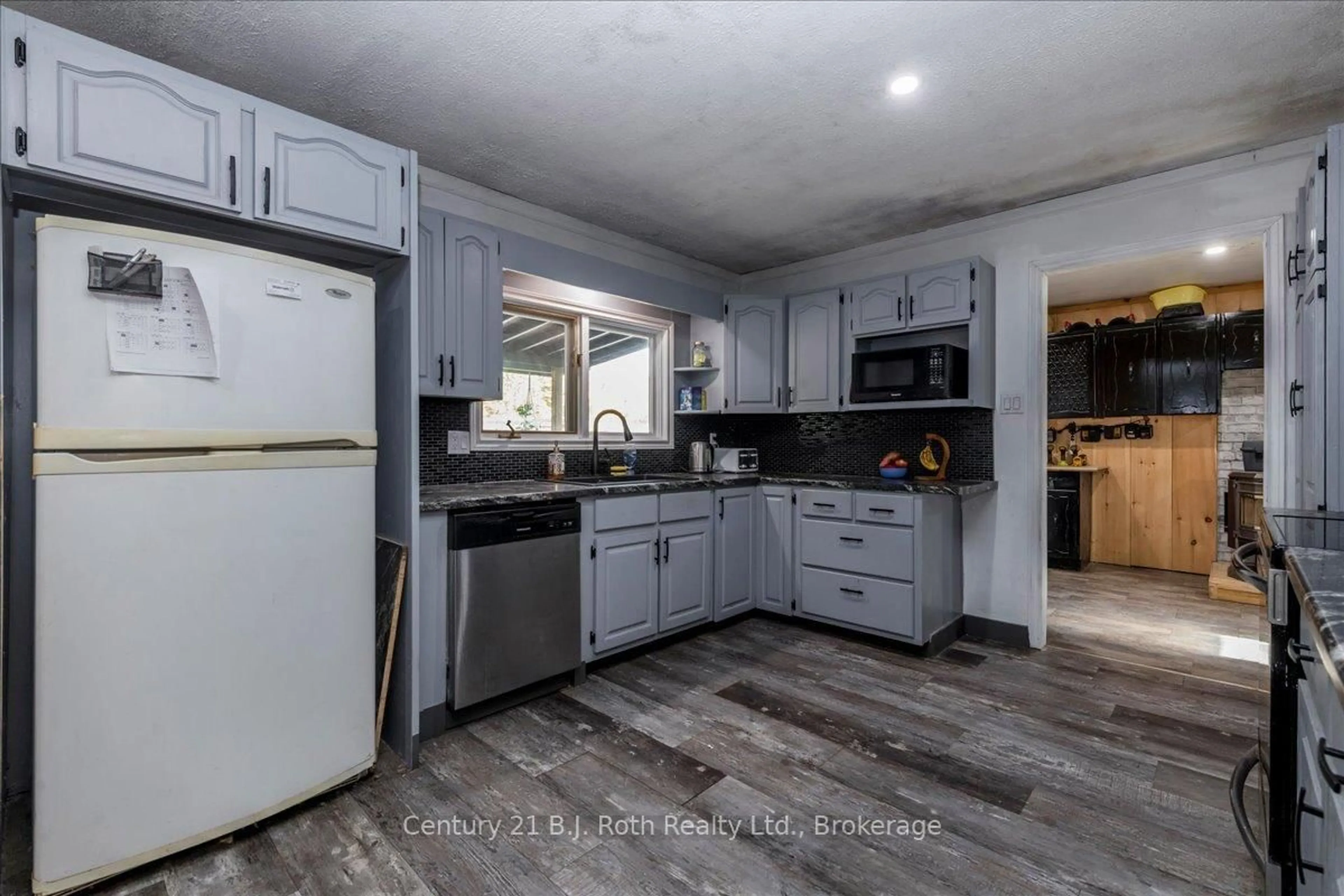 Open concept kitchen, ceramic/tile floor for 2286 Flos 10 Rd, Springwater Ontario L0L 1P0