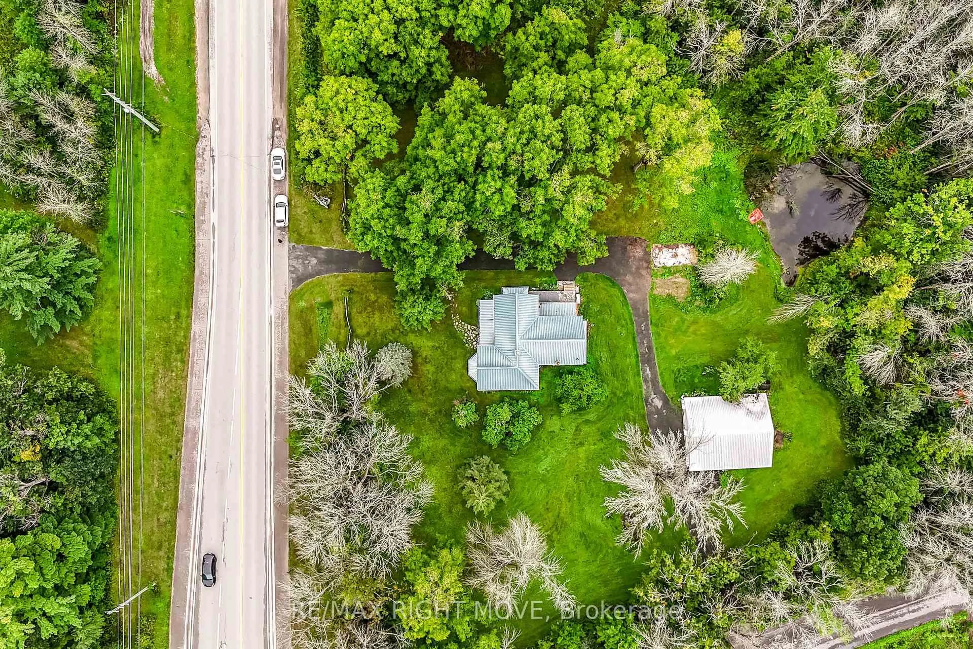 A pic from outside/outdoor area/front of a property/back of a property/a pic from drone, street for 7514 Rama Rd, Ramara Ontario L0K 2B0