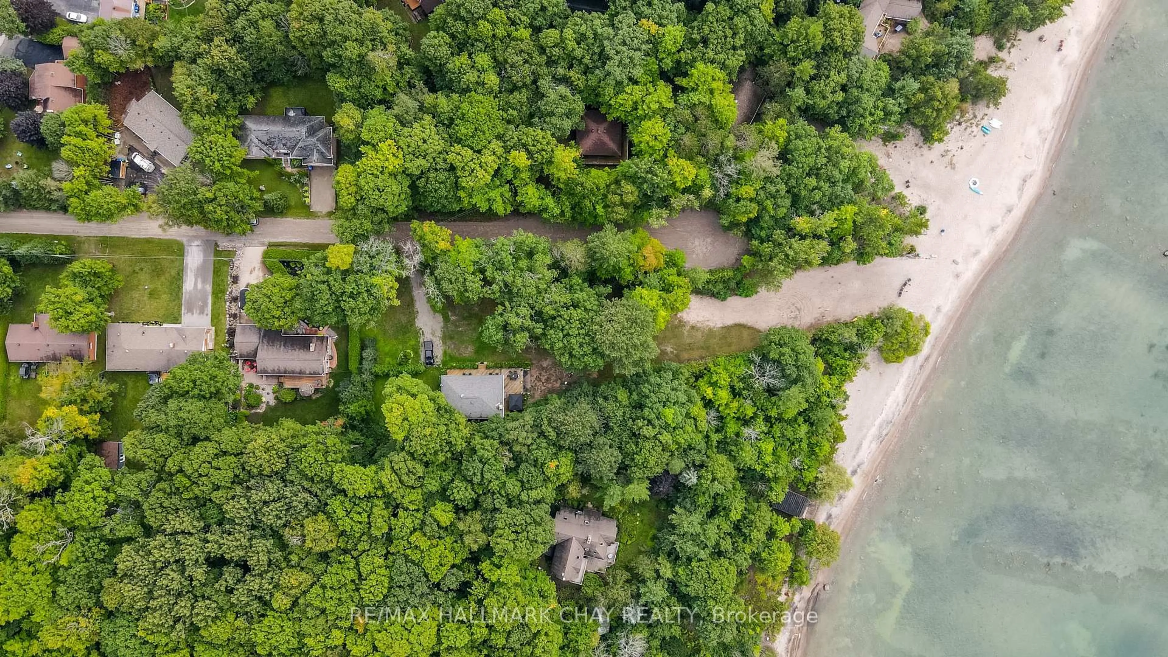 A pic from outside/outdoor area/front of a property/back of a property/a pic from drone, water/lake/river/ocean view for 10 Enchantment Ave, Tiny Ontario L9M 0H5