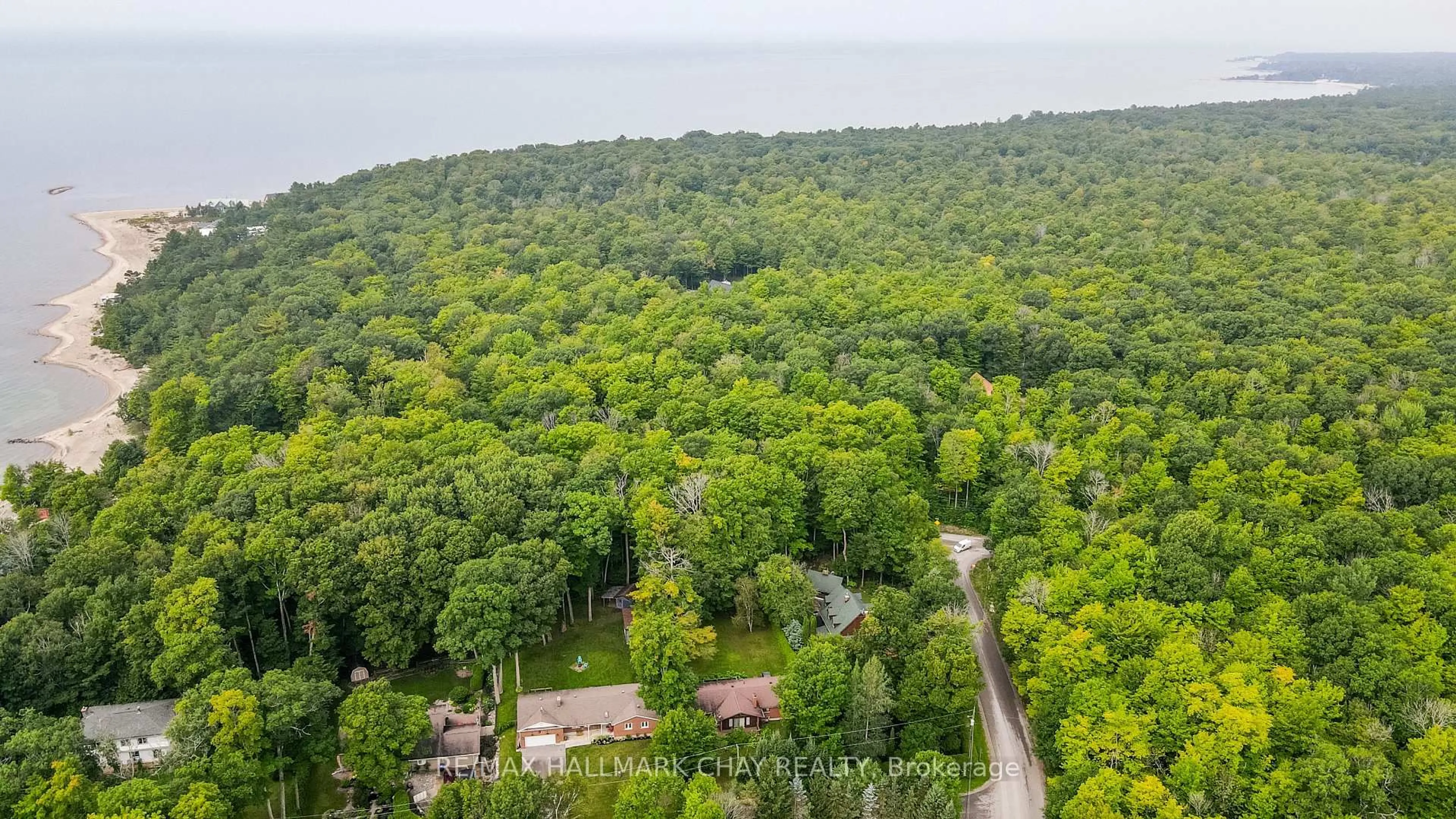 A pic from outside/outdoor area/front of a property/back of a property/a pic from drone, forest/trees view for 10 Enchantment Ave, Tiny Ontario L9M 0H5