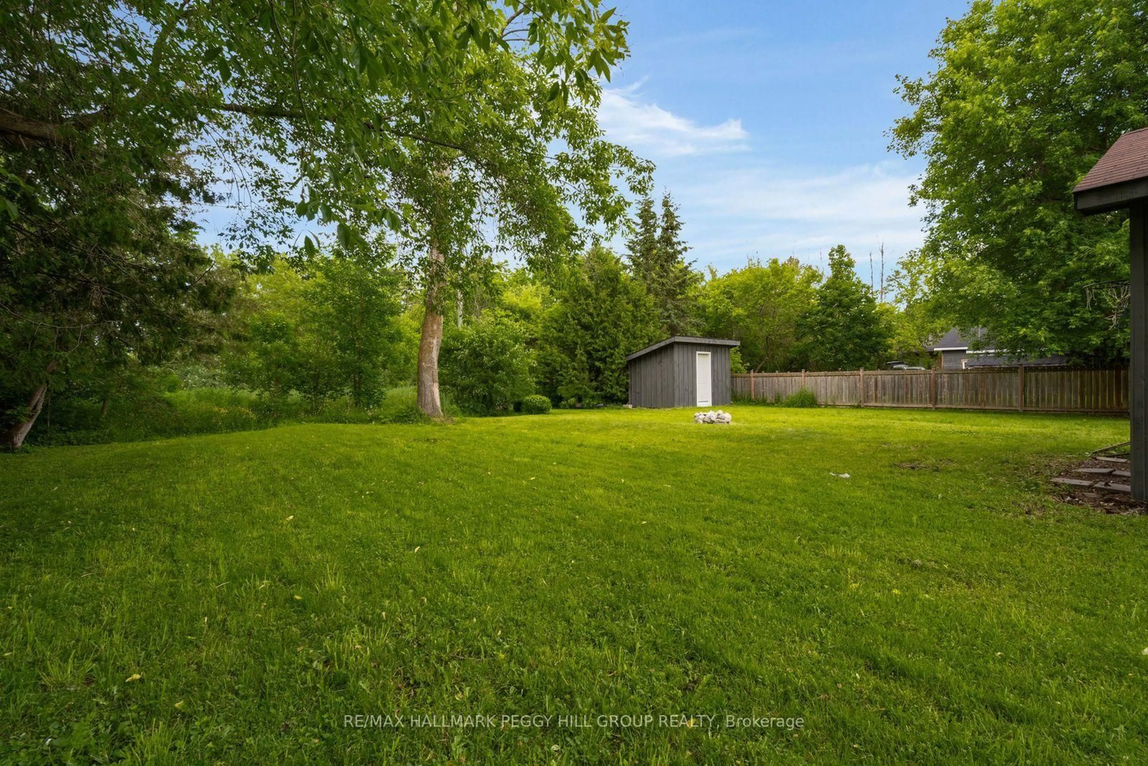 A pic from outside/outdoor area/front of a property/back of a property/a pic from drone, forest/trees view for 132 Queen St, Springwater Ontario L0L 1P0