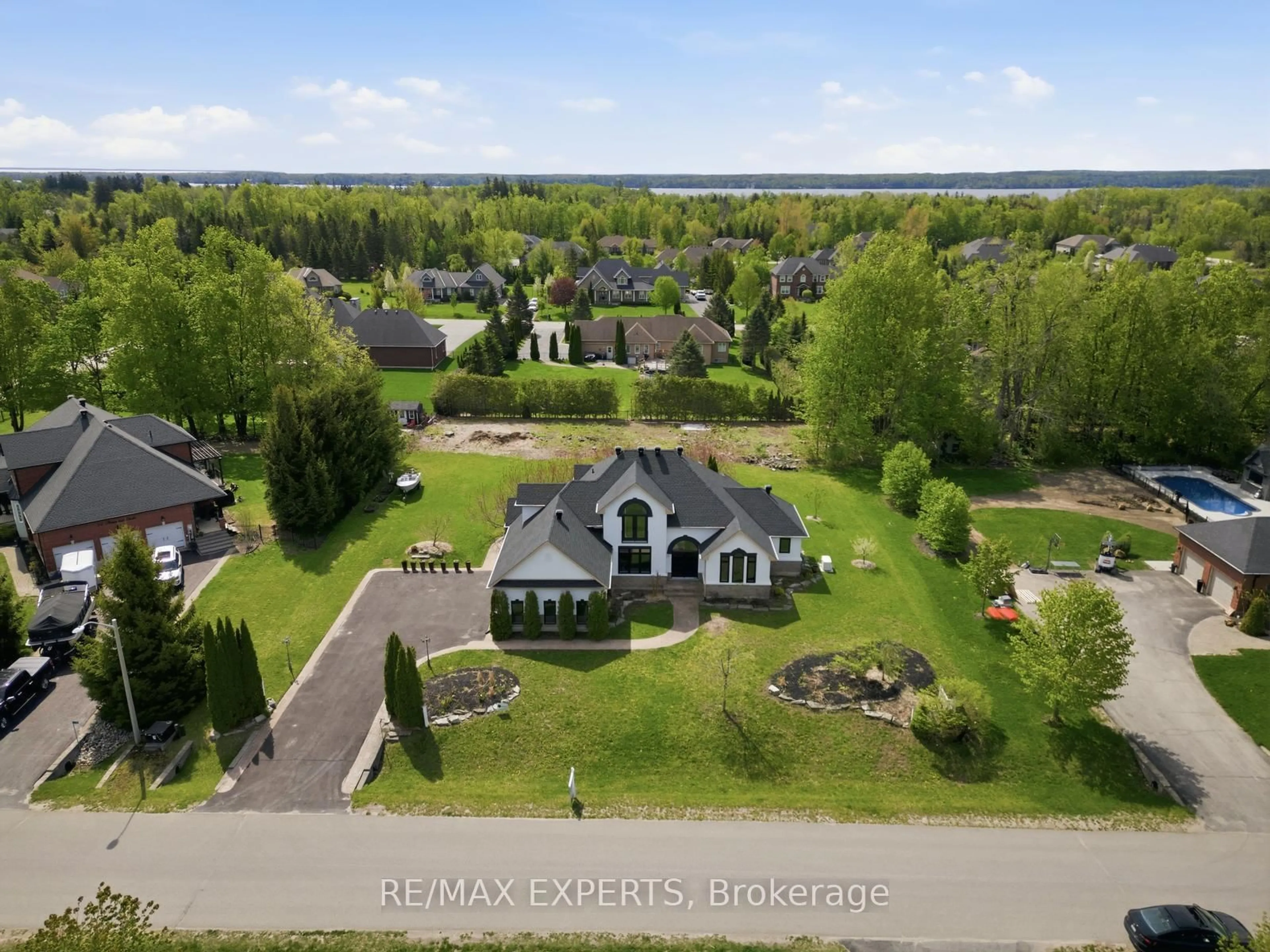 A pic from outside/outdoor area/front of a property/back of a property/a pic from drone, water/lake/river/ocean view for 11 Basswood Circ, Oro-Medonte Ontario L0L 2L0