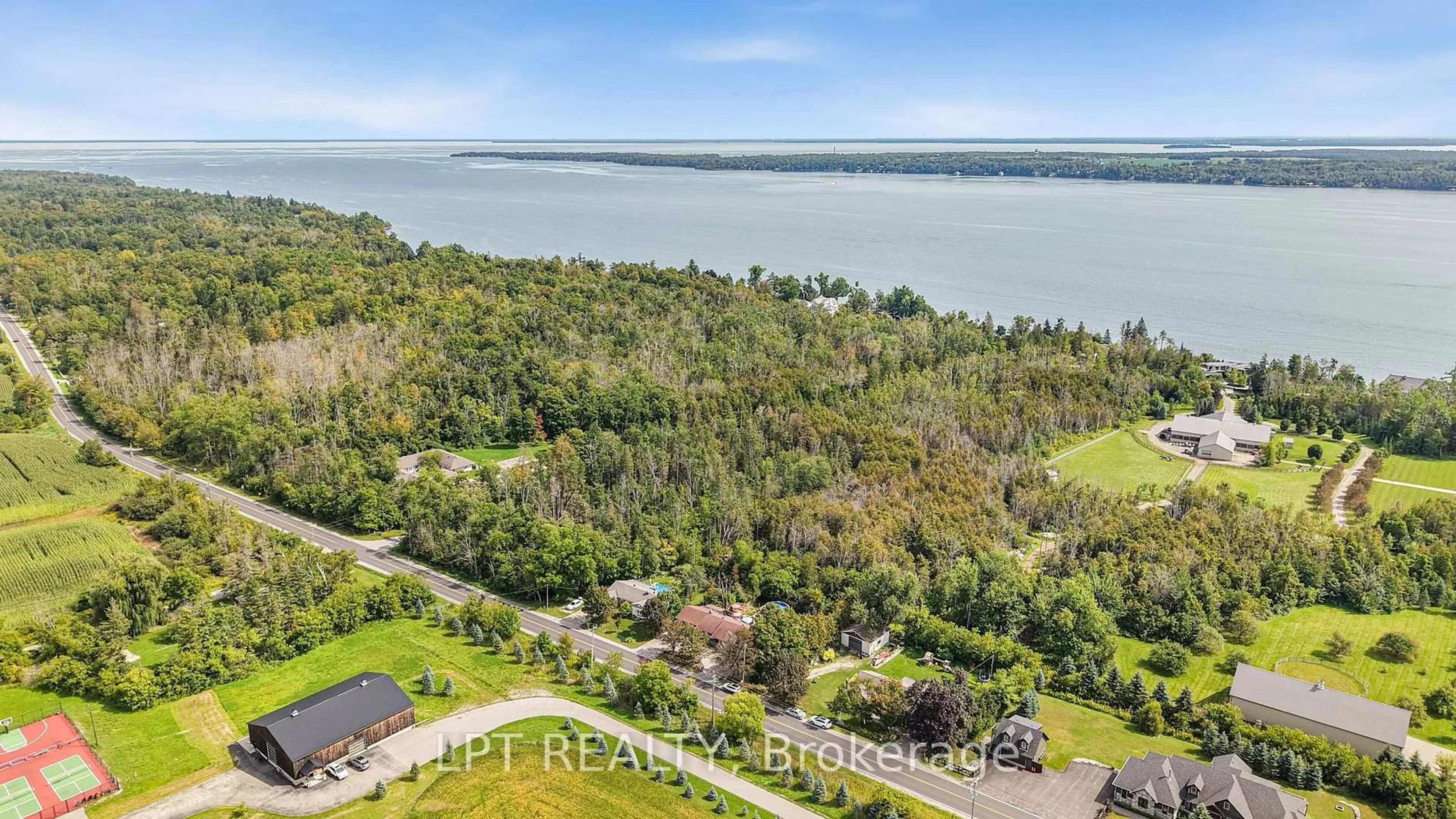 A pic from outside/outdoor area/front of a property/back of a property/a pic from drone, water/lake/river/ocean view for 2447 Ridge Rd, Oro-Medonte Ontario L0L 2L0
