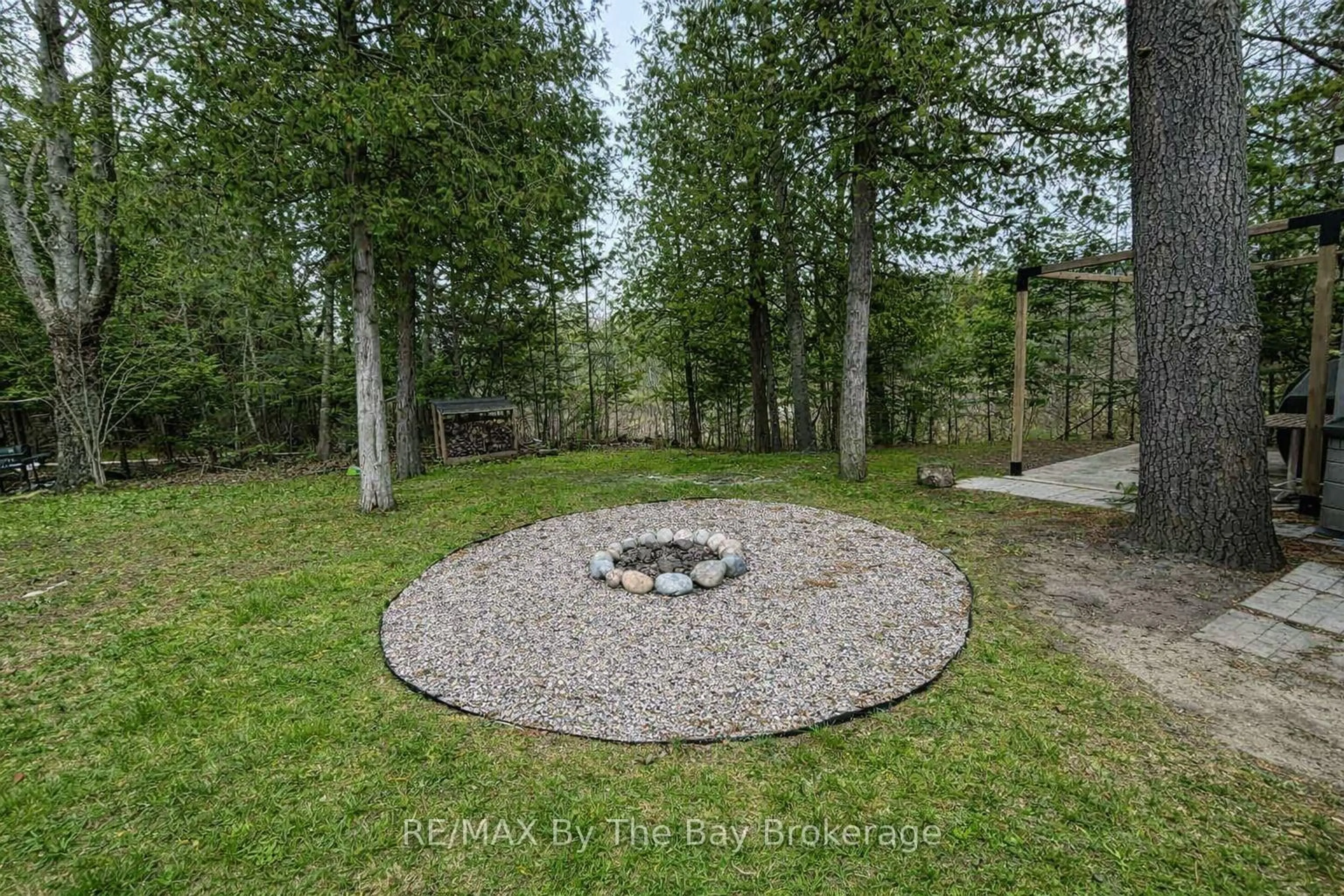 A pic from outside/outdoor area/front of a property/back of a property/a pic from drone, forest/trees view for 83 MADAWASKA Tr, Wasaga Beach Ontario L9Z 1X7
