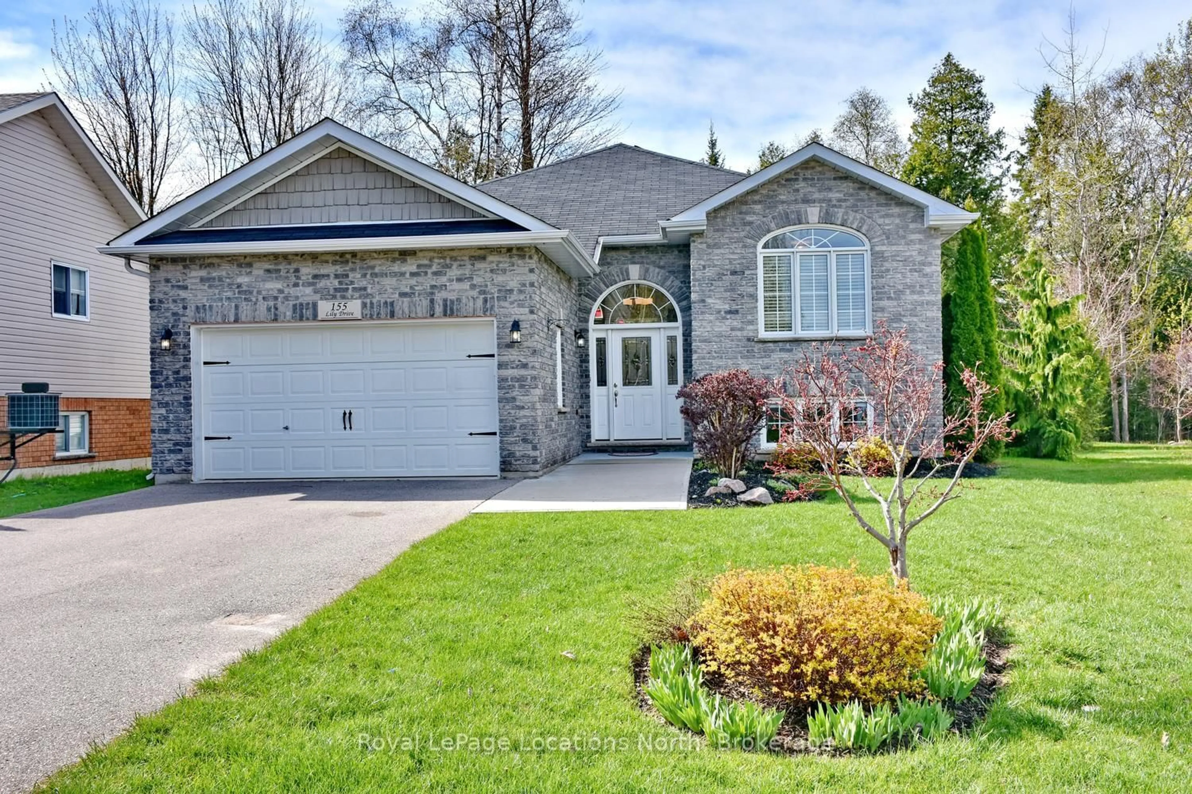 Home with brick exterior material, street for 155 Lily Dr, Wasaga Beach Ontario L9Z 2Z5