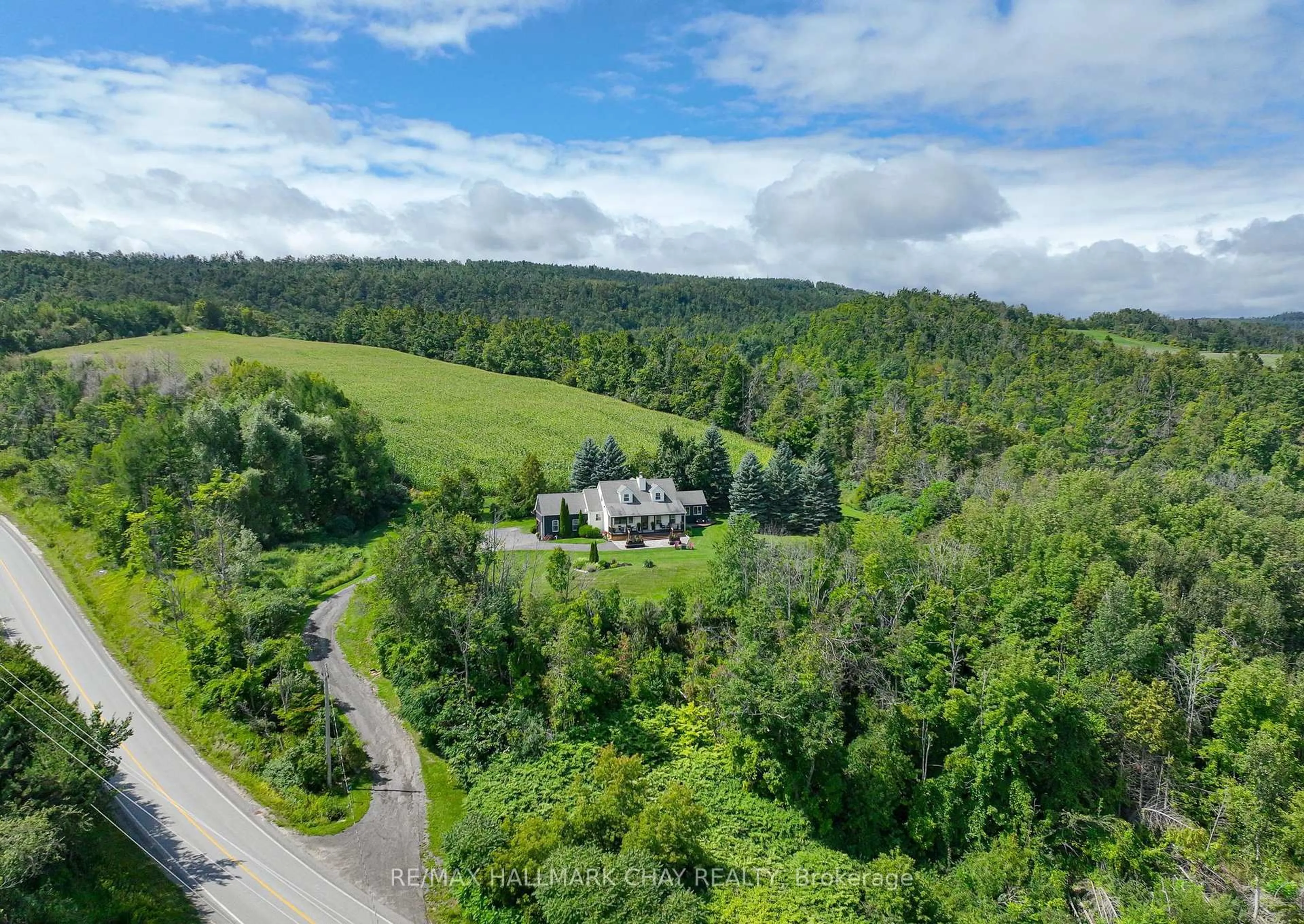 A pic from outside/outdoor area/front of a property/back of a property/a pic from drone, forest/trees view for 2110 Concession 8 Rd, Clearview Ontario L0M 1L0