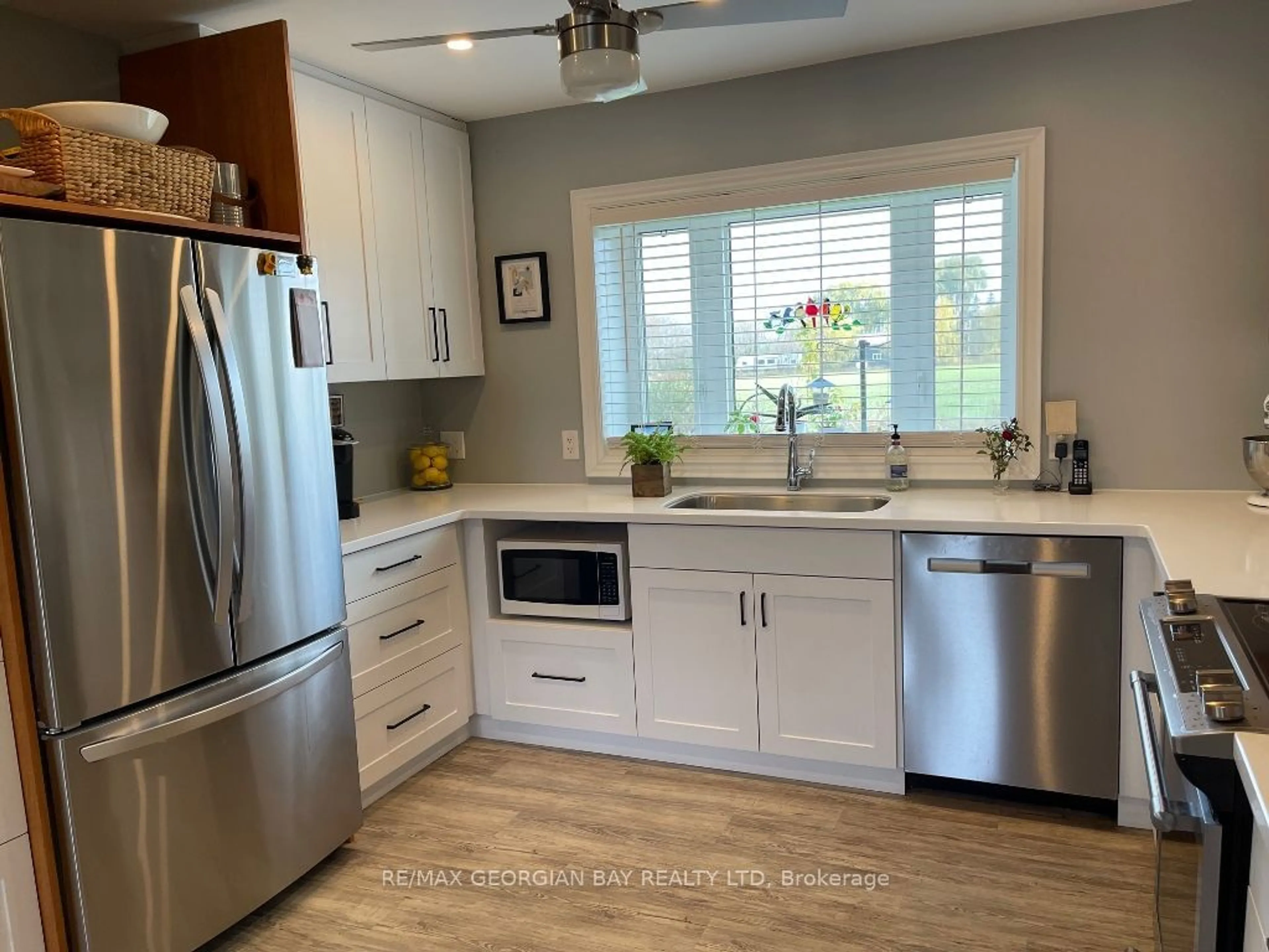 Open concept kitchen, ceramic/tile floor for 1954 Flos 8 Rd, Springwater Ontario L0L 1P0