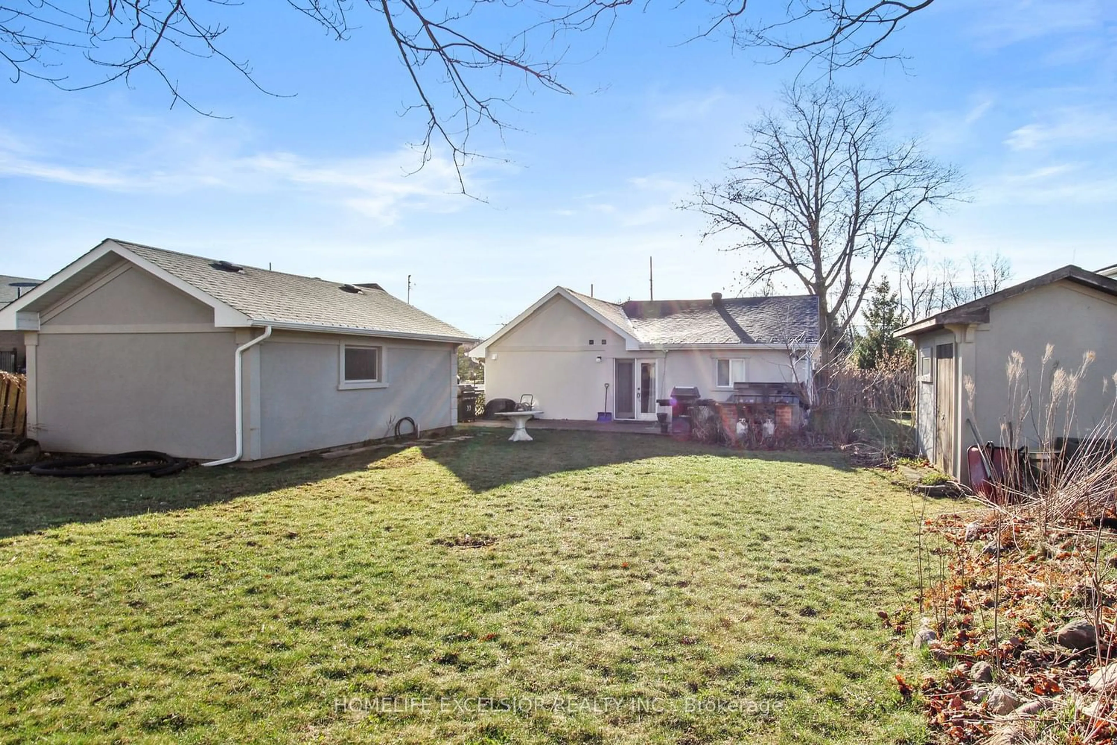 Frontside or backside of a home, the fenced backyard for 827 Essa Rd, Barrie Ontario L4N 9G5