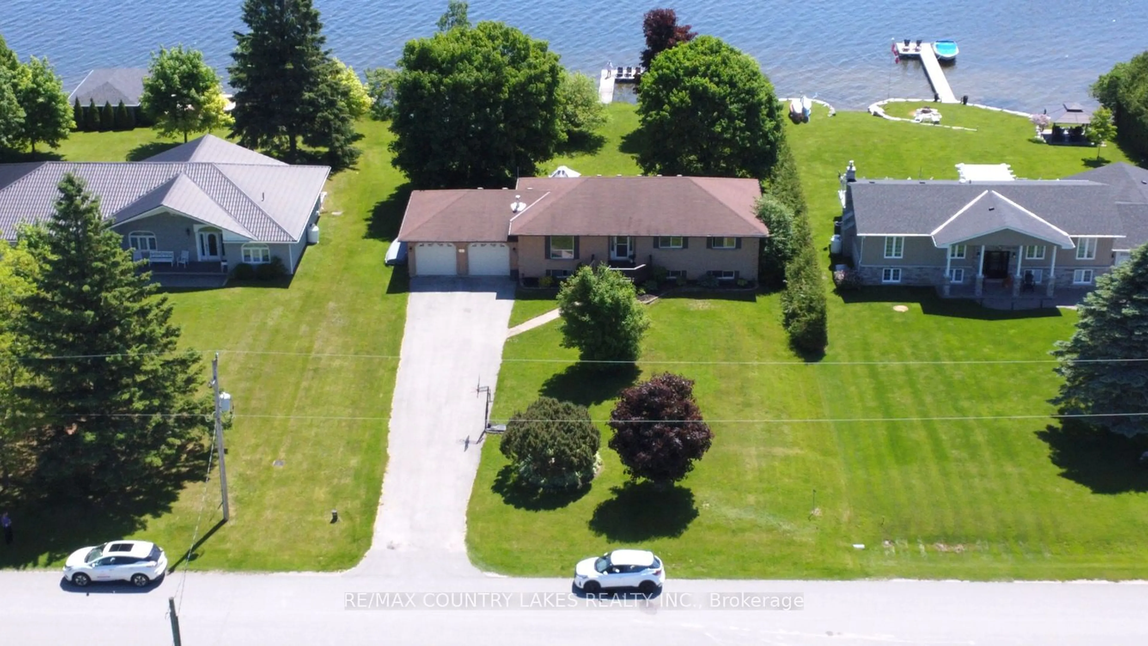 Frontside or backside of a home, the street view for 84 Pinewood Blvd, Kawartha Lakes Ontario K0M 2T0