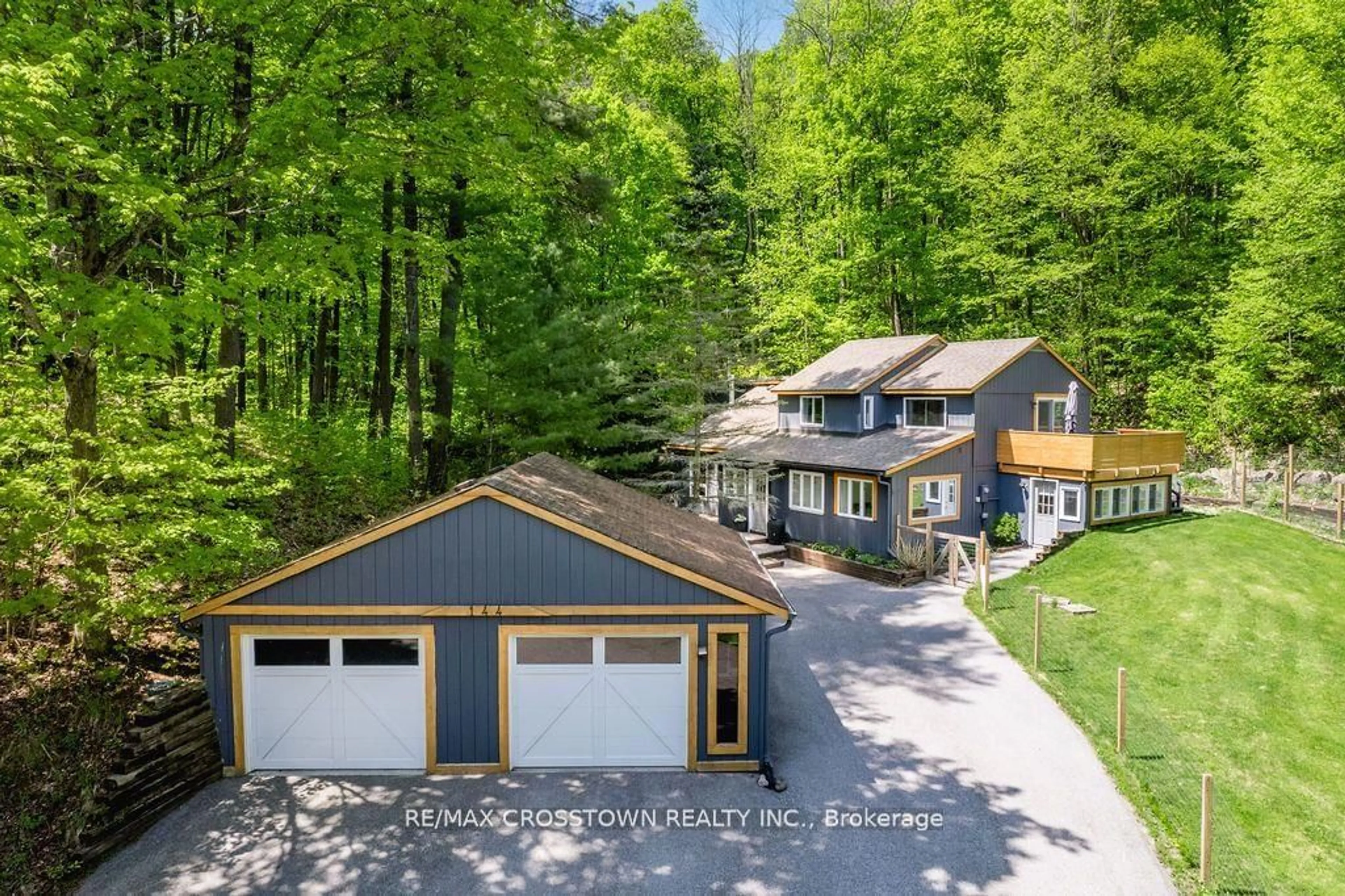 Frontside or backside of a home for 144 Huronwoods Dr, Oro-Medonte Ontario L0K 1E0