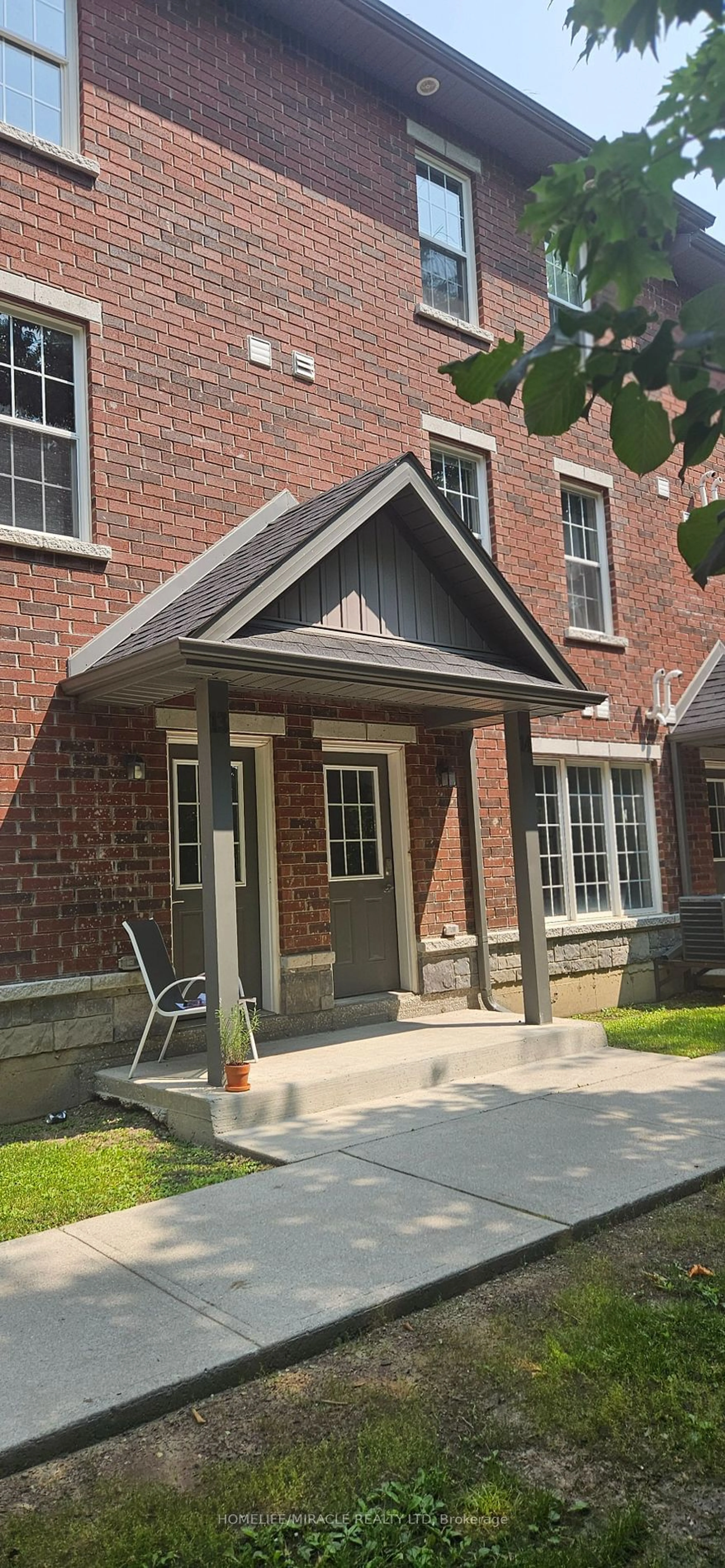 Home with brick exterior material for 242 PENETANGUISHENE Rd #13, Barrie Ontario L4M 7C2