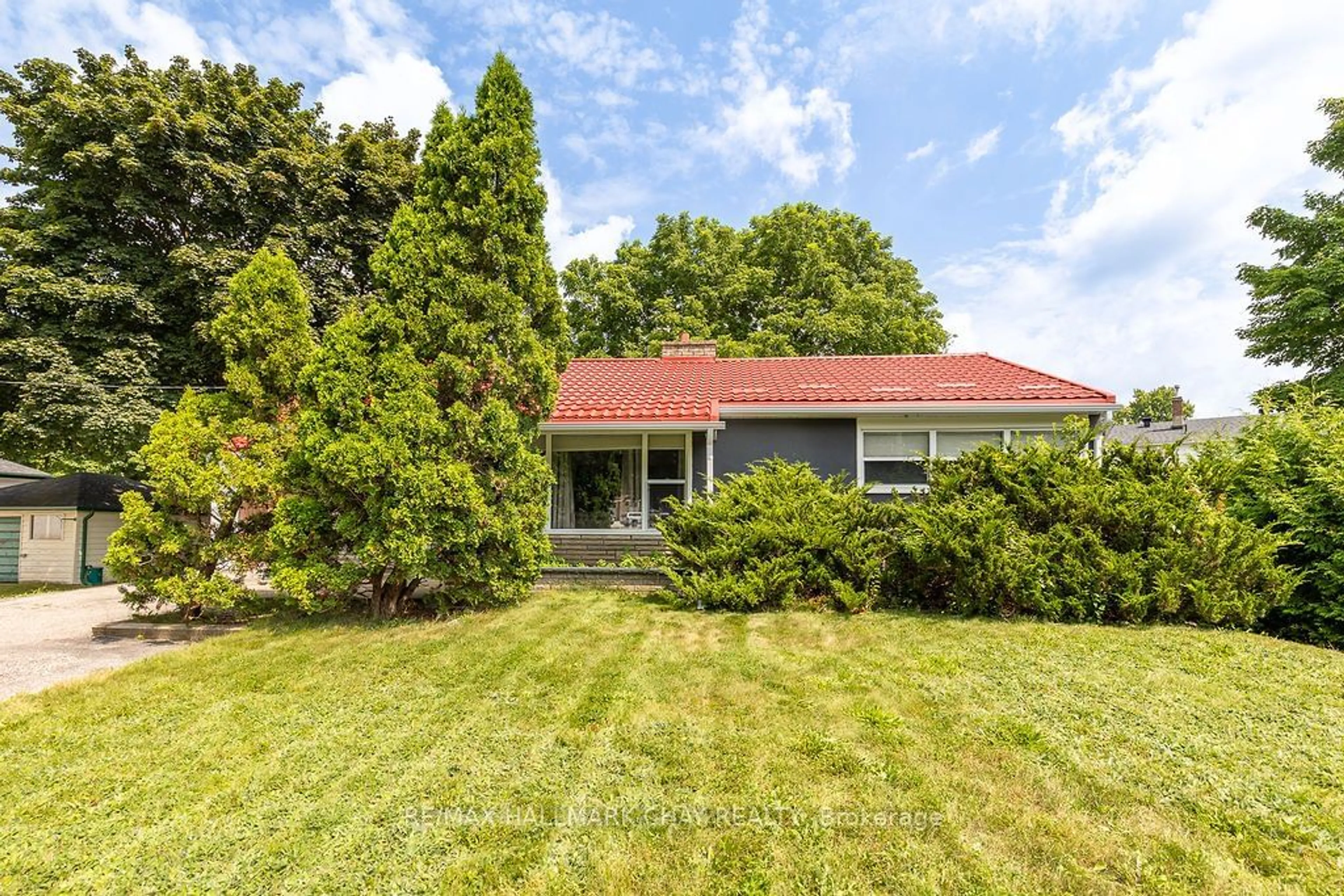 Frontside or backside of a home, the fenced backyard for 325 Innisfil St, Barrie Ontario L4N 3G4