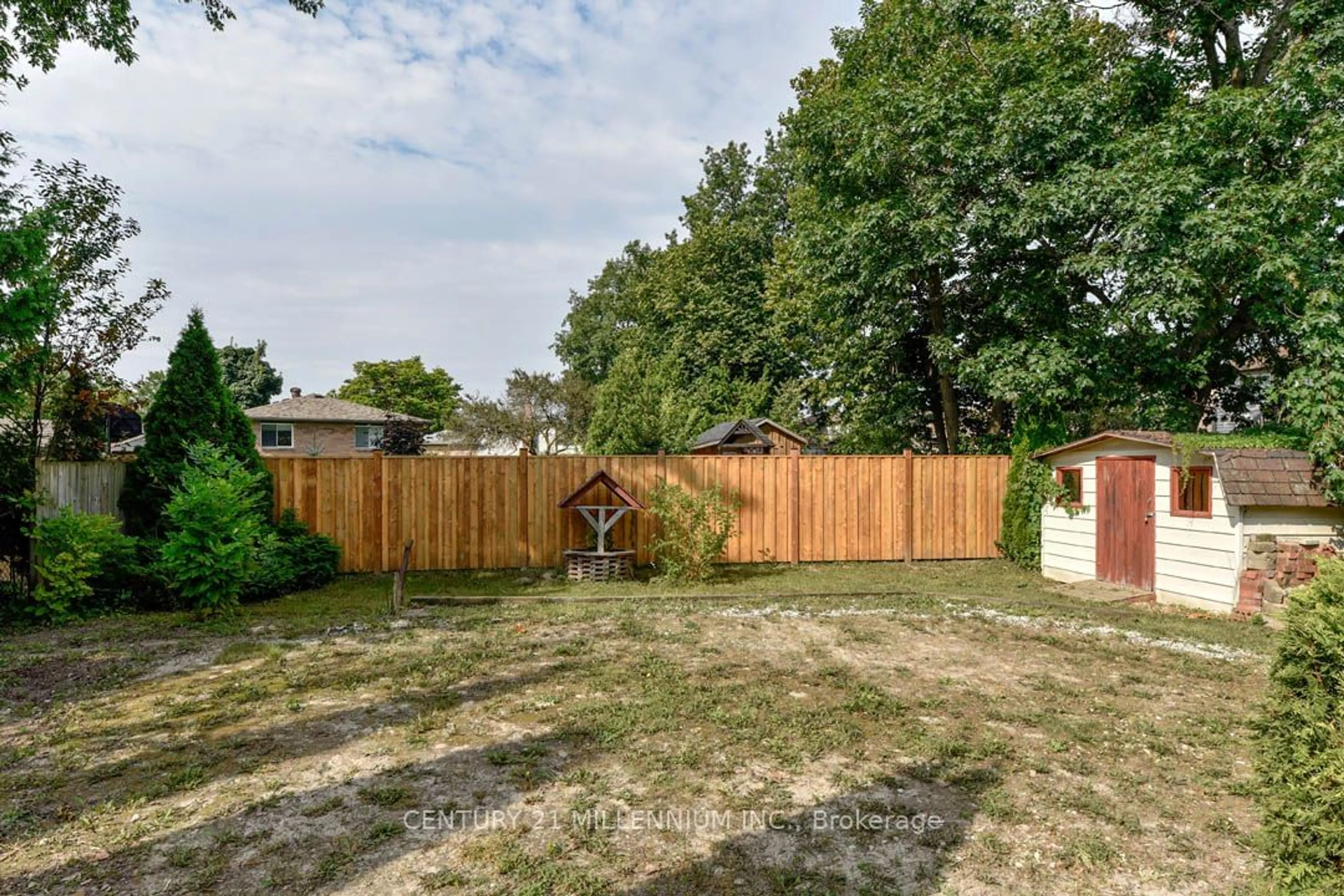 Frontside or backside of a home, the fenced backyard for 24 Coles St, Barrie Ontario L4N 5W8