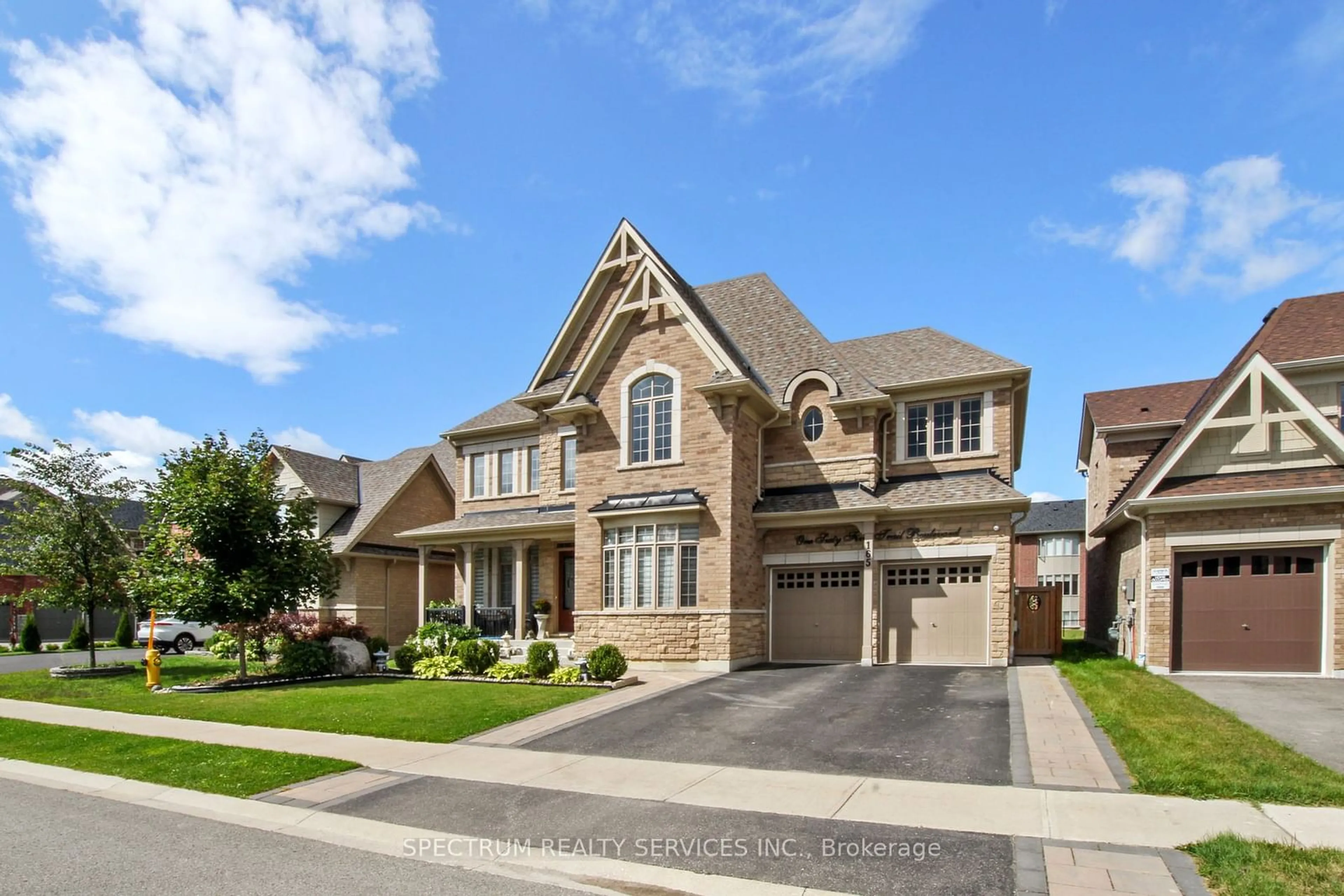 Frontside or backside of a home, the street view for 165 Trail Blvd, Springwater Ontario L9X 0S7