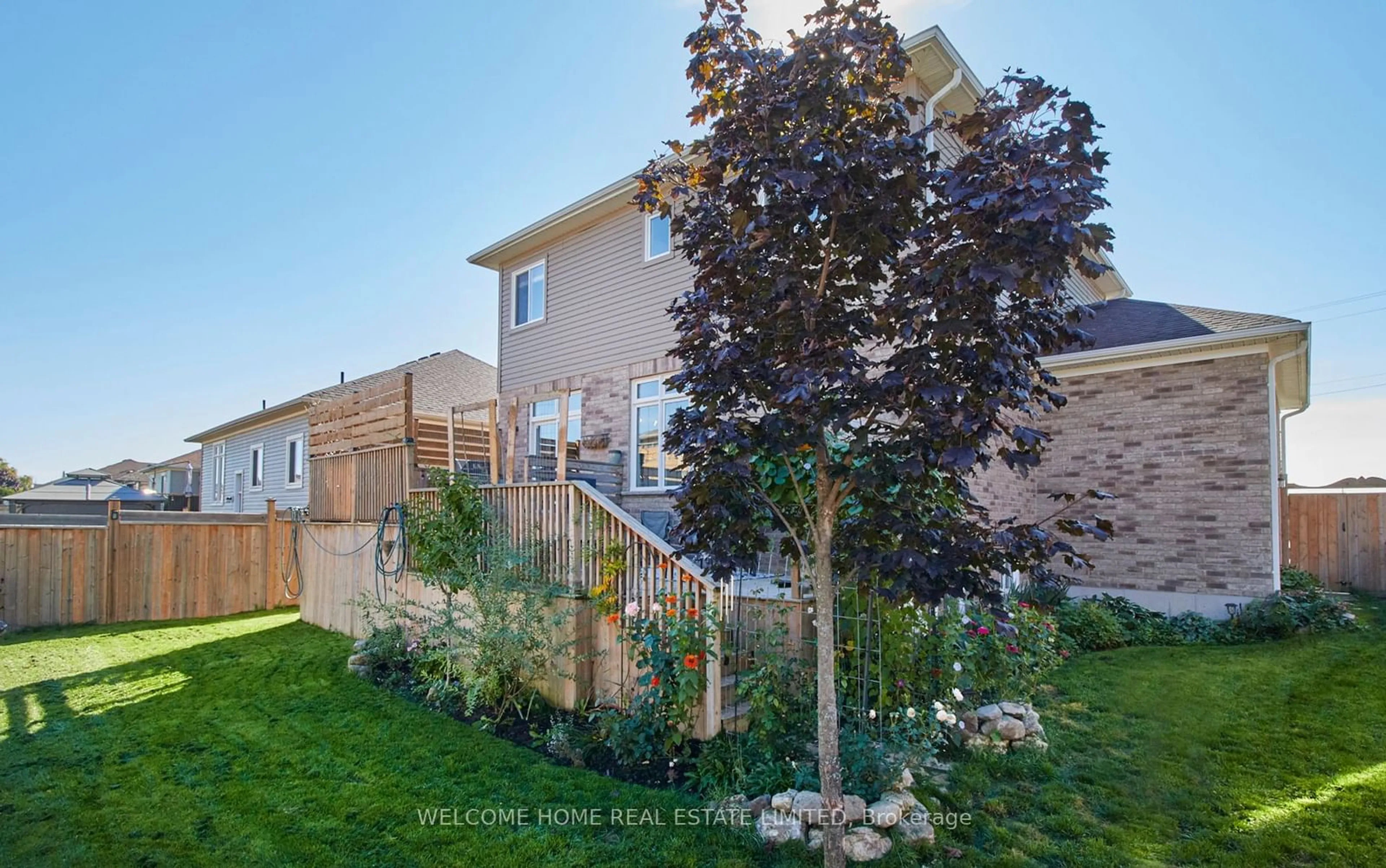 A pic from exterior of the house or condo, the fenced backyard for 233 Centre St, Clearview Ontario L0M 1S0