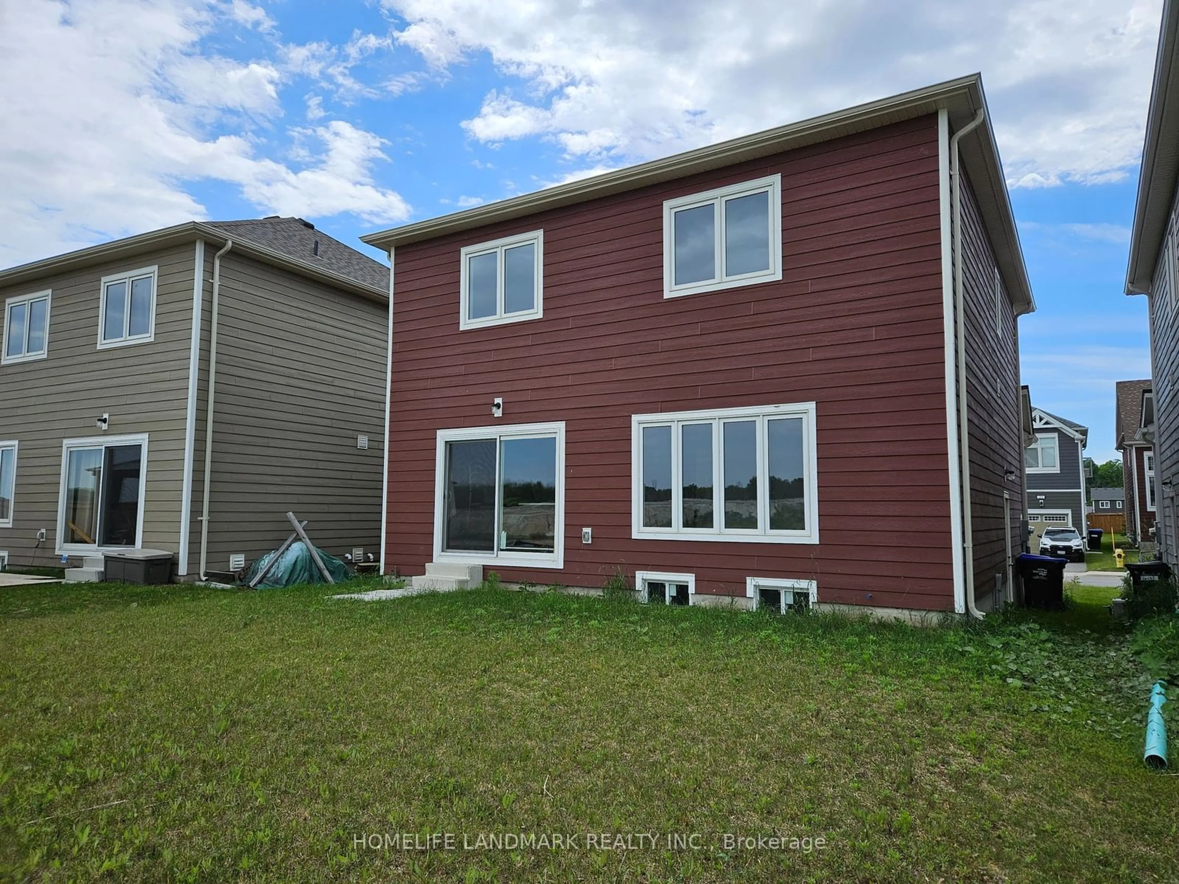 Frontside or backside of a home, the fenced backyard for 20 Sandhill Crane Dr, Wasaga Beach Ontario L9Z 0J6