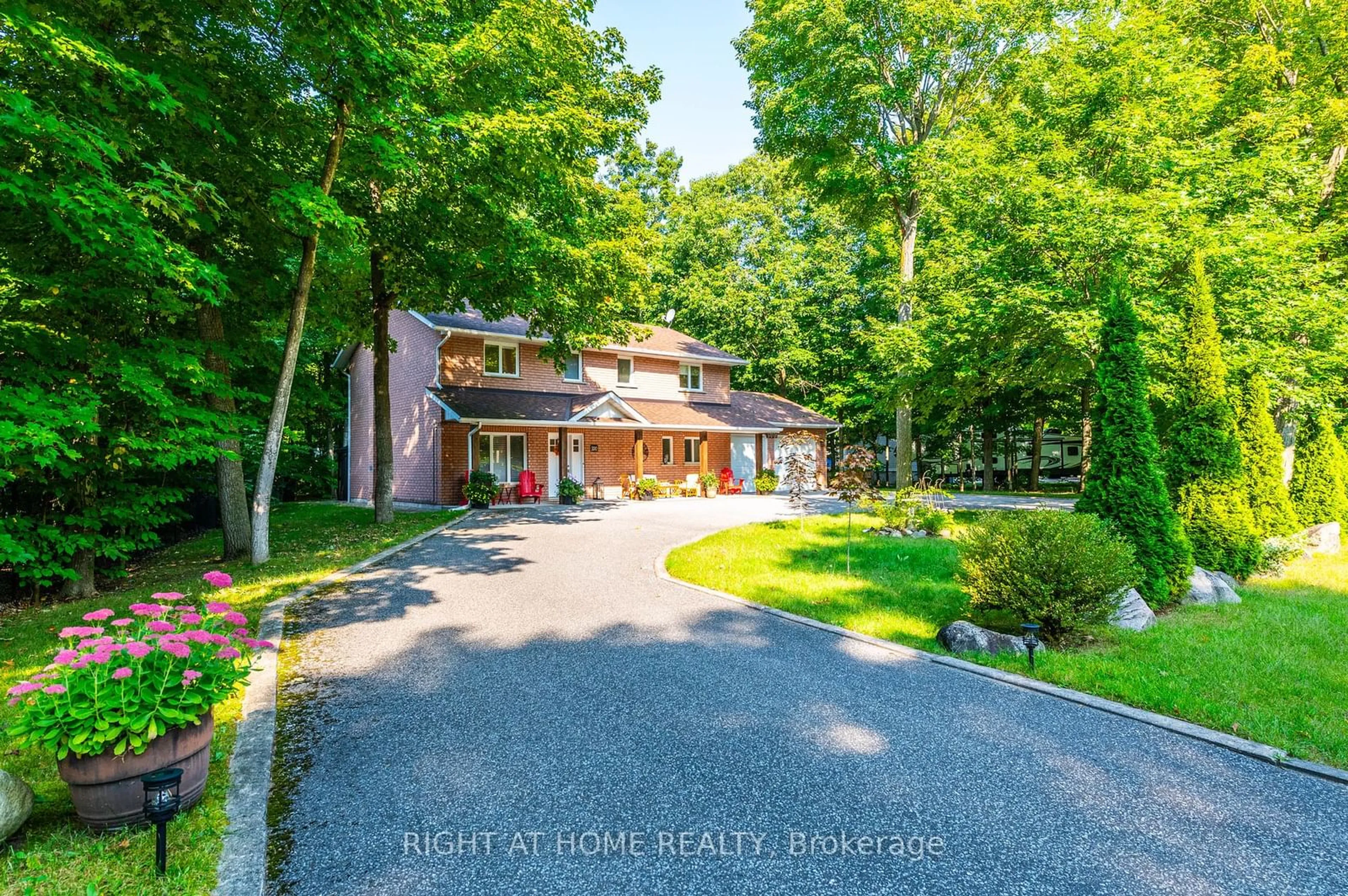 Frontside or backside of a home for 100 Desroches Tr, Tiny Ontario L9M 0H9