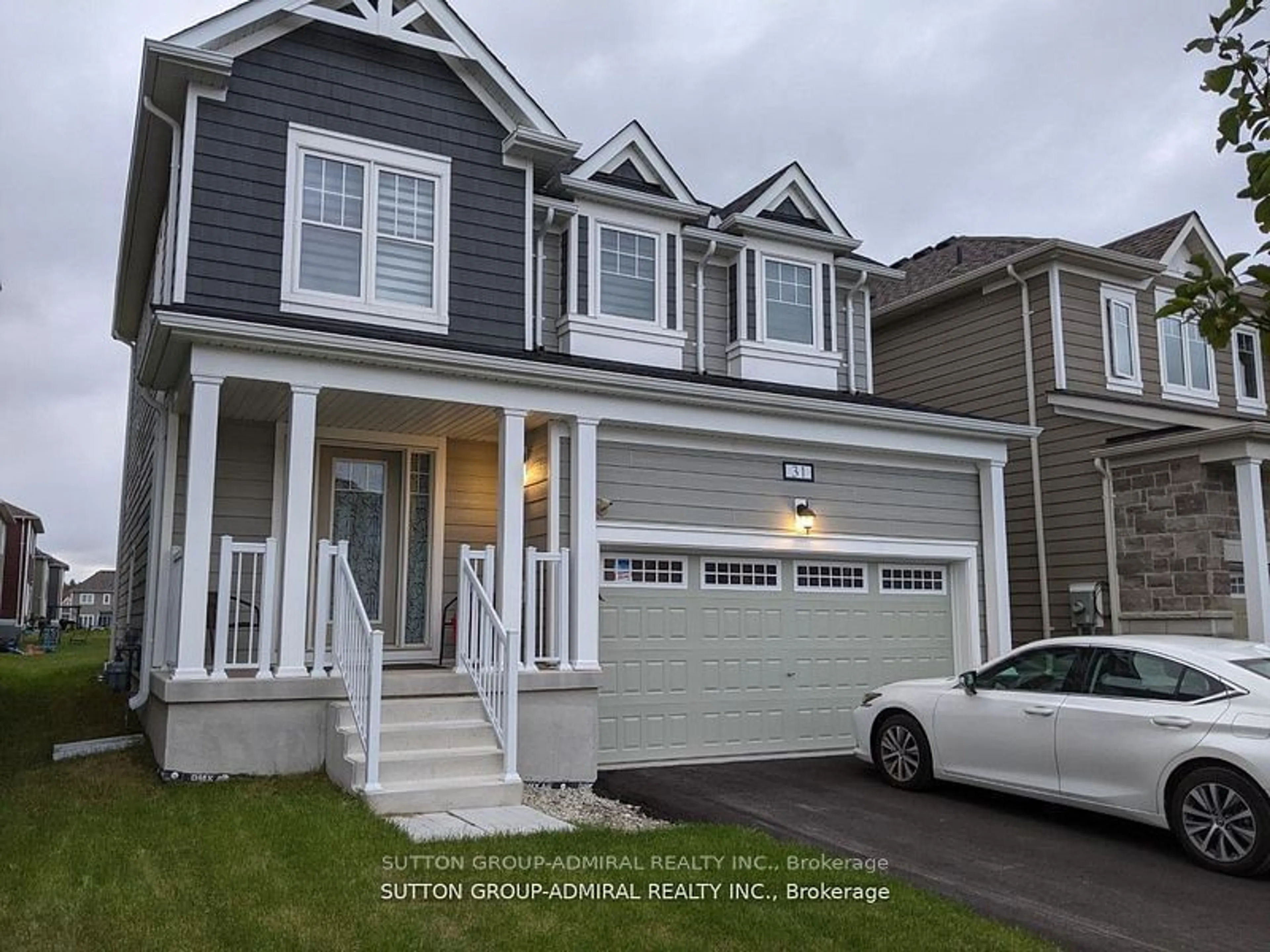 Home with vinyl exterior material, street for 31 Sandhill Crane Dr, Wasaga Beach Ontario L9Z 0J2