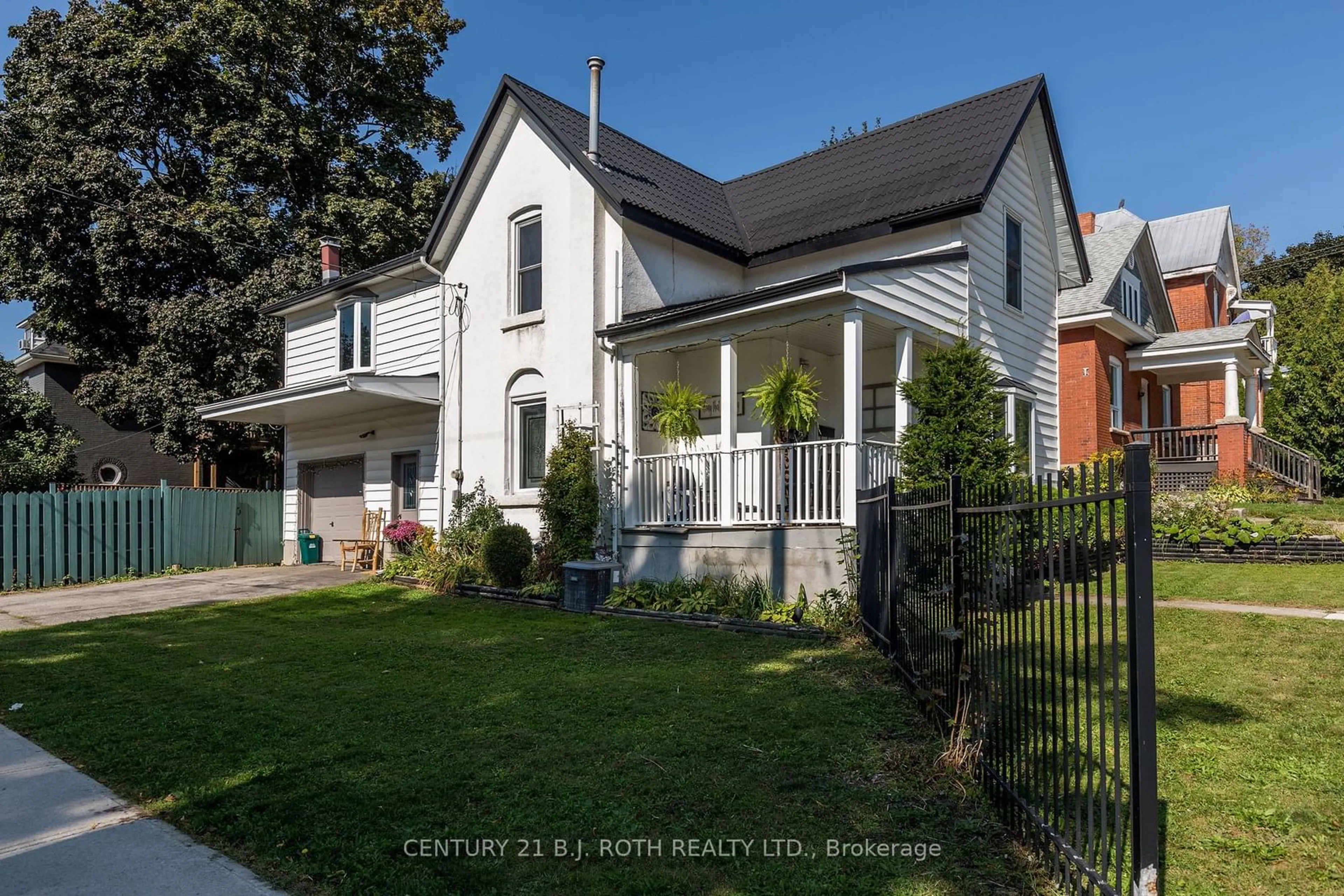 Frontside or backside of a home, the fenced backyard for 61 O'brien St, Orillia Ontario L3V 5S5