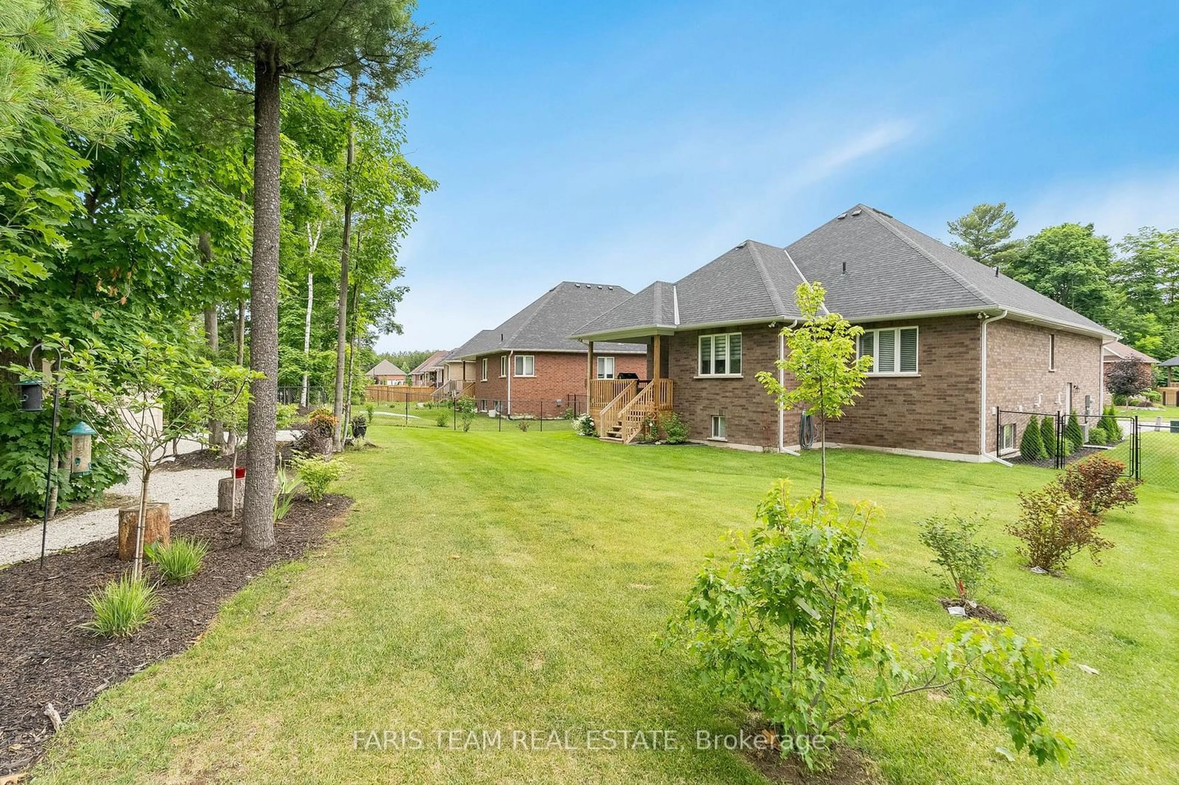 Frontside or backside of a home, the fenced backyard for 26 Natures Tr, Wasaga Beach Ontario L9Z 0H4