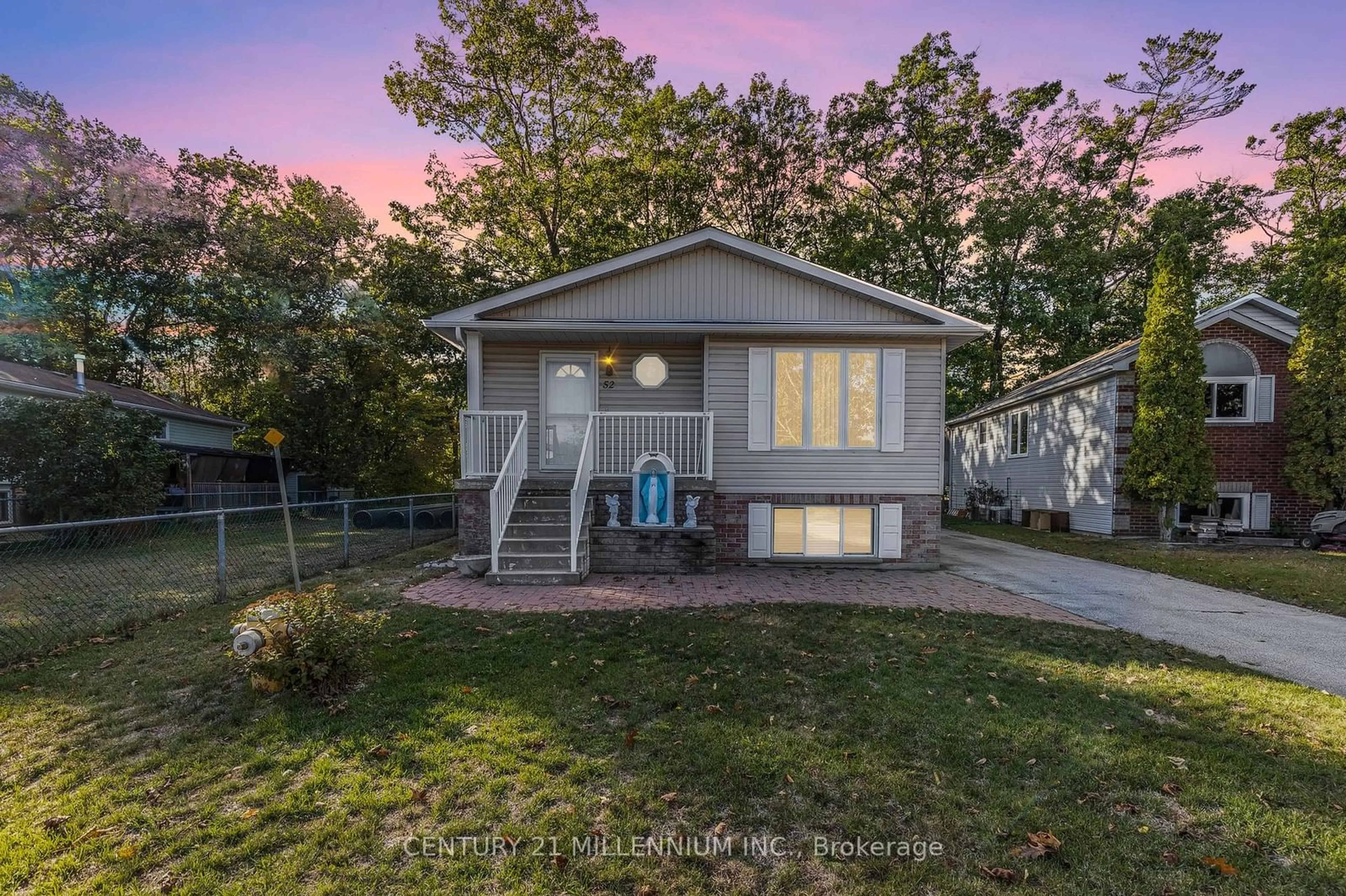 Frontside or backside of a home, the fenced backyard for 52 Dyer Dr, Wasaga Beach Ontario L9Z 1E2