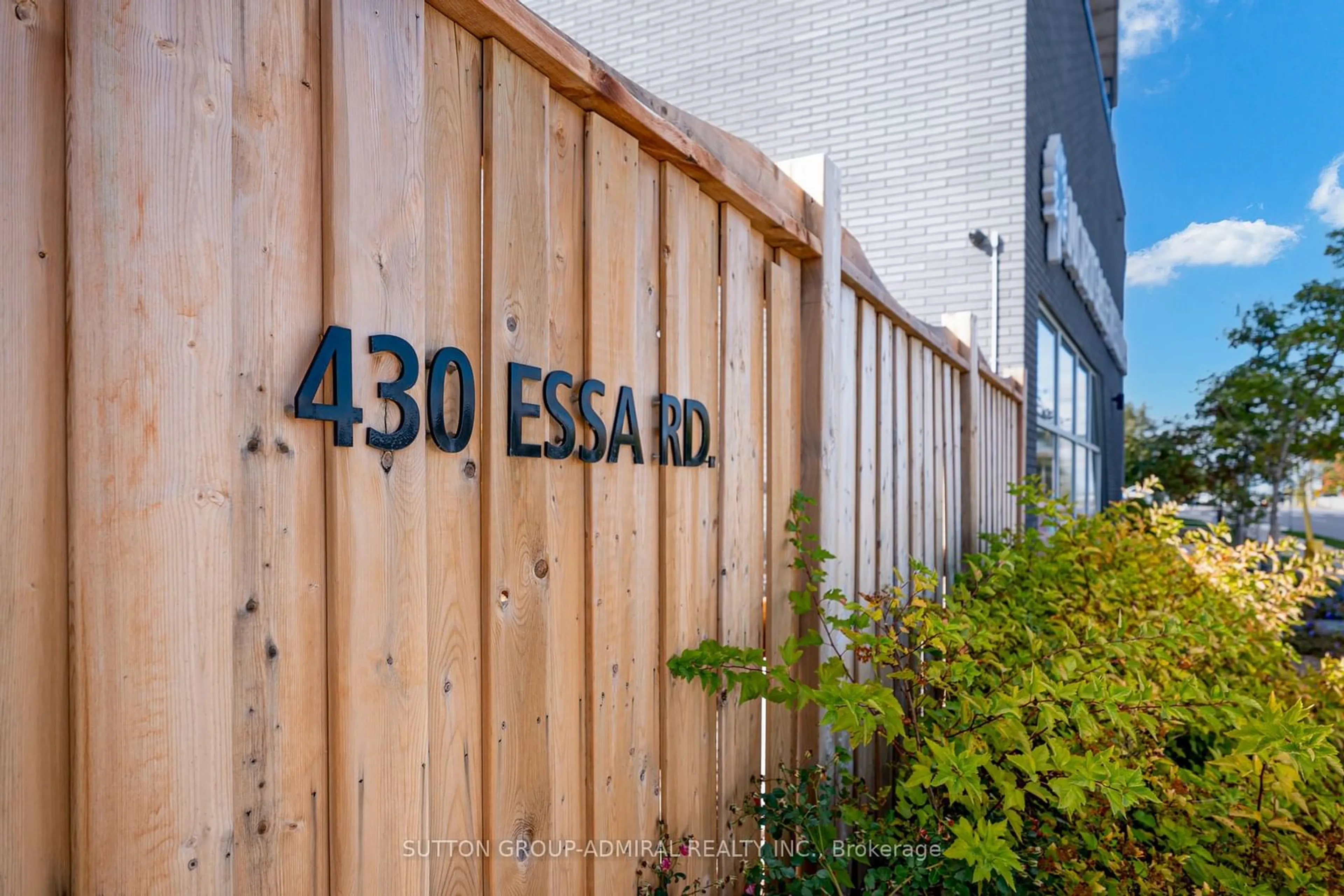 A pic from exterior of the house or condo, the fenced backyard for 430 Essa Rd #323, Barrie Ontario L9J 0M1