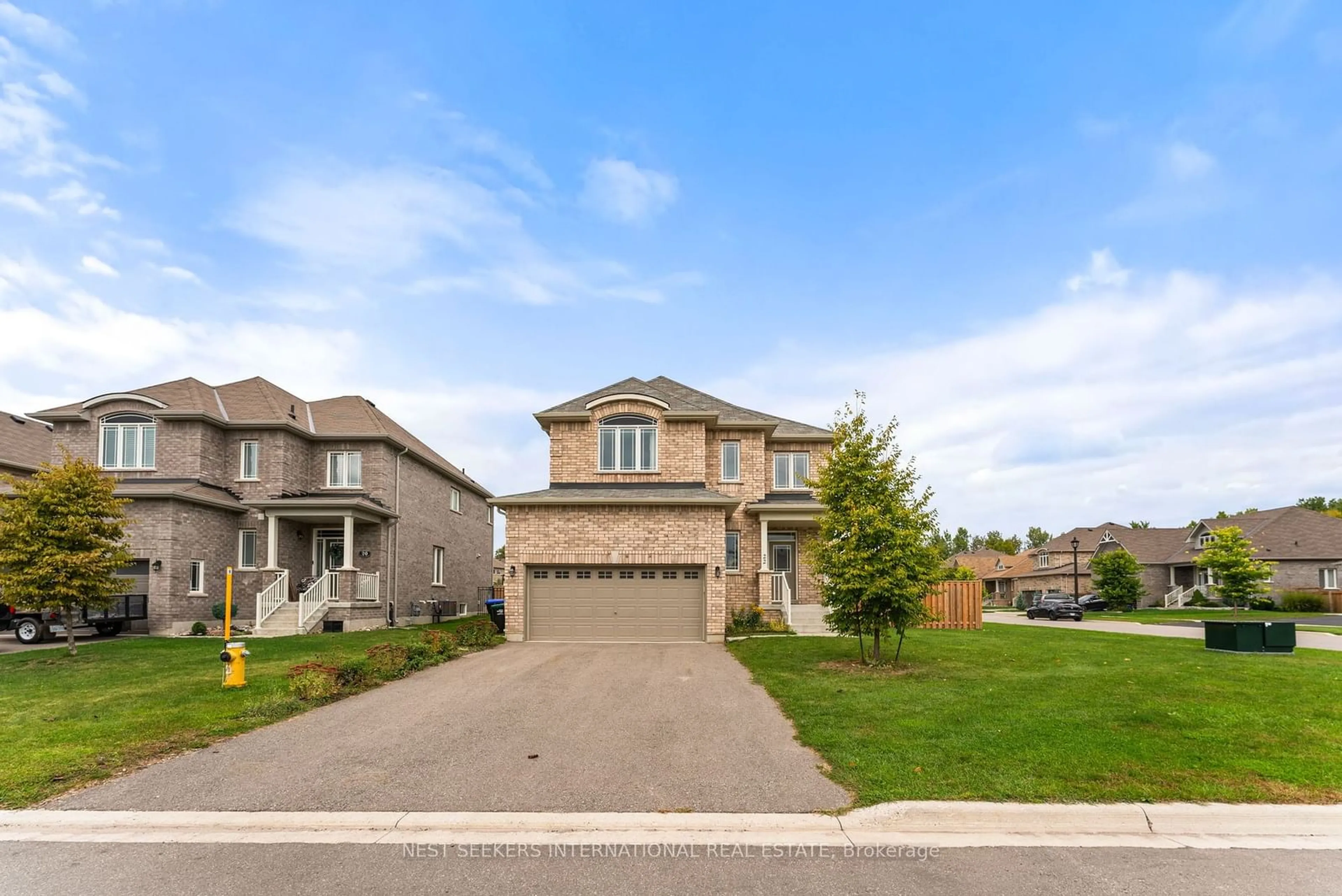 Frontside or backside of a home, the street view for 22 Pearl St, Wasaga Beach Ontario L9Z 0G9