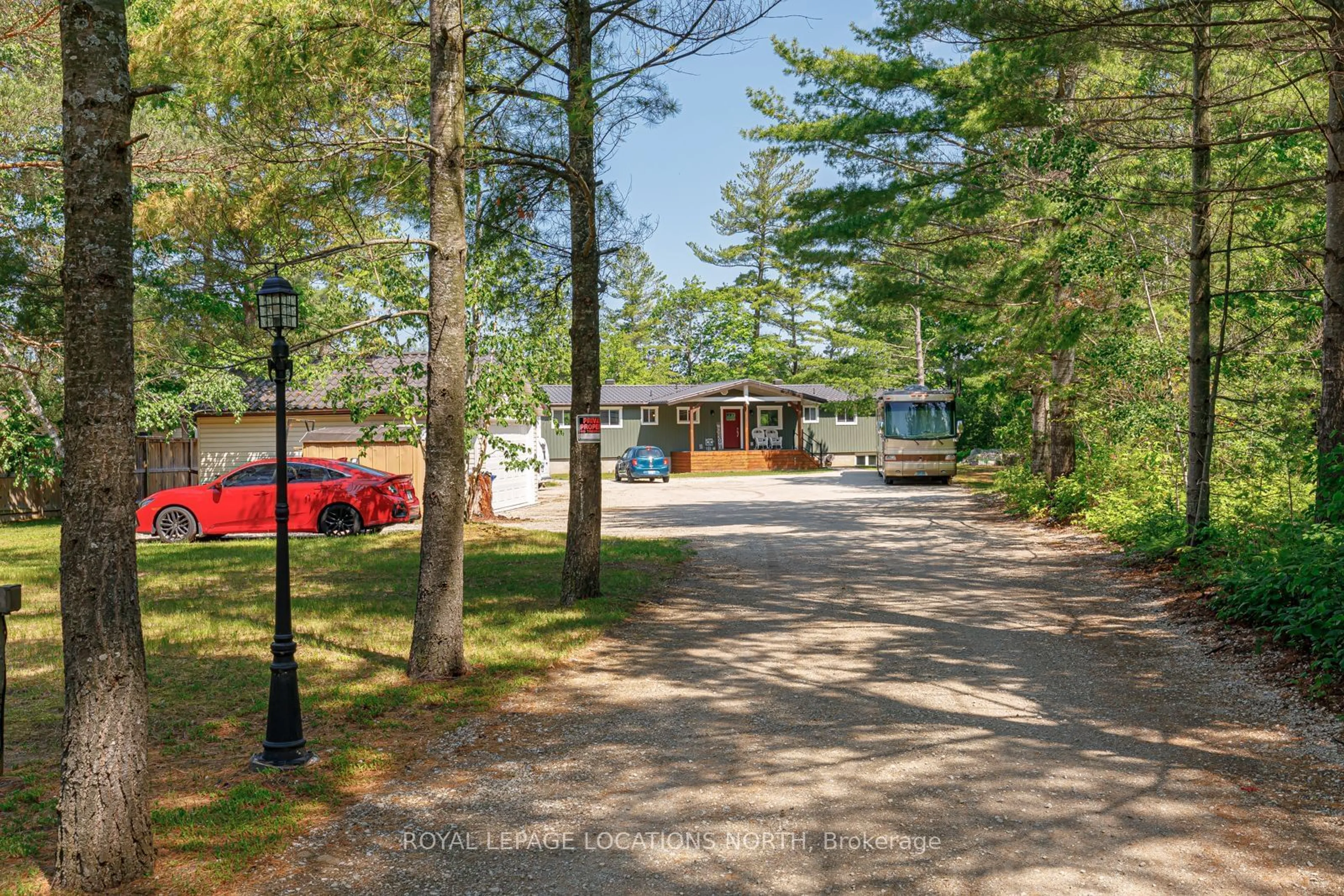 A pic from exterior of the house or condo, the street view for 1628 River Rd, Wasaga Beach Ontario L9Z 2S3