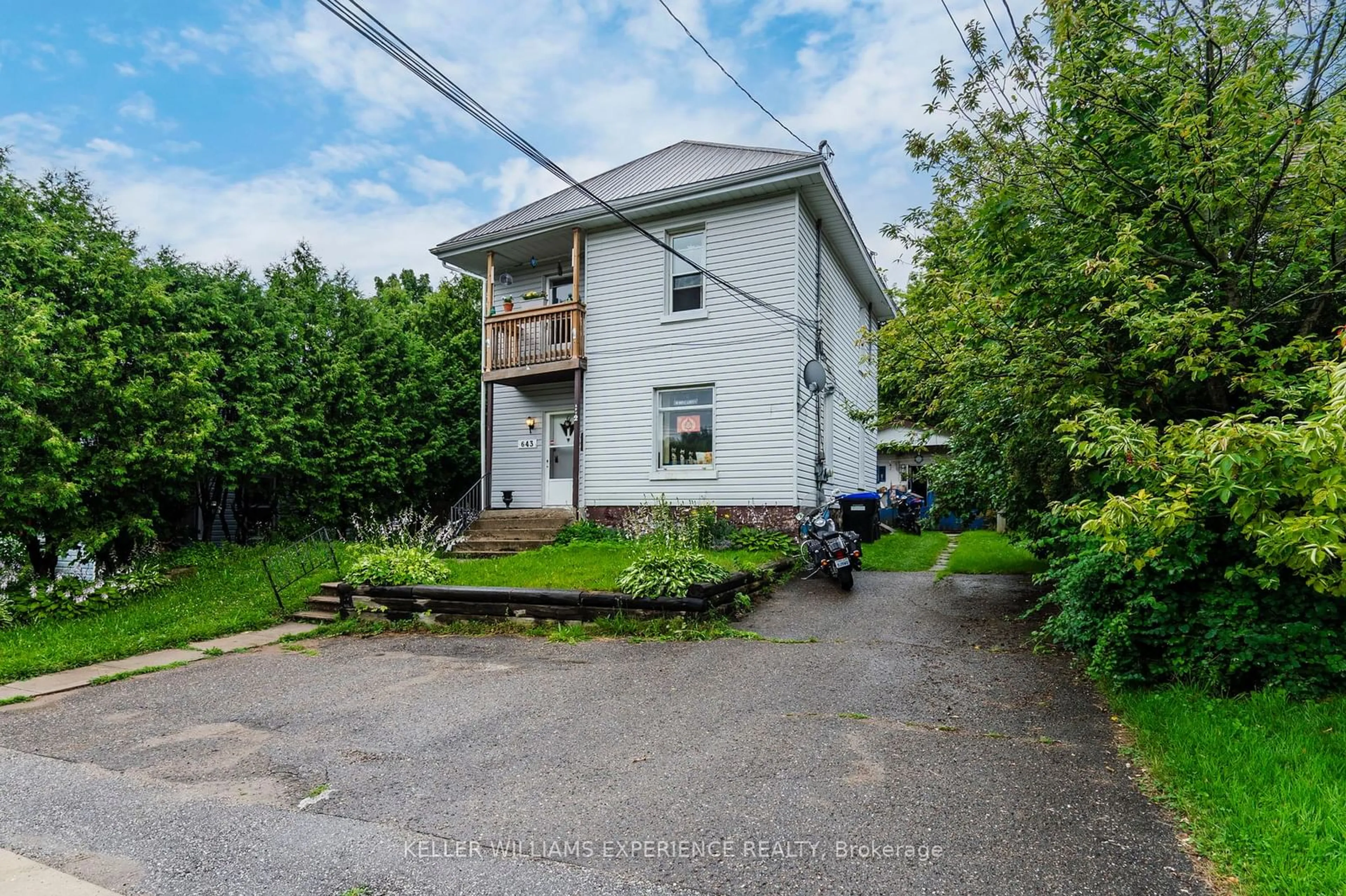 A pic from exterior of the house or condo, the fenced backyard for 643 645 Dominion Ave, Midland Ontario L4R 1R6