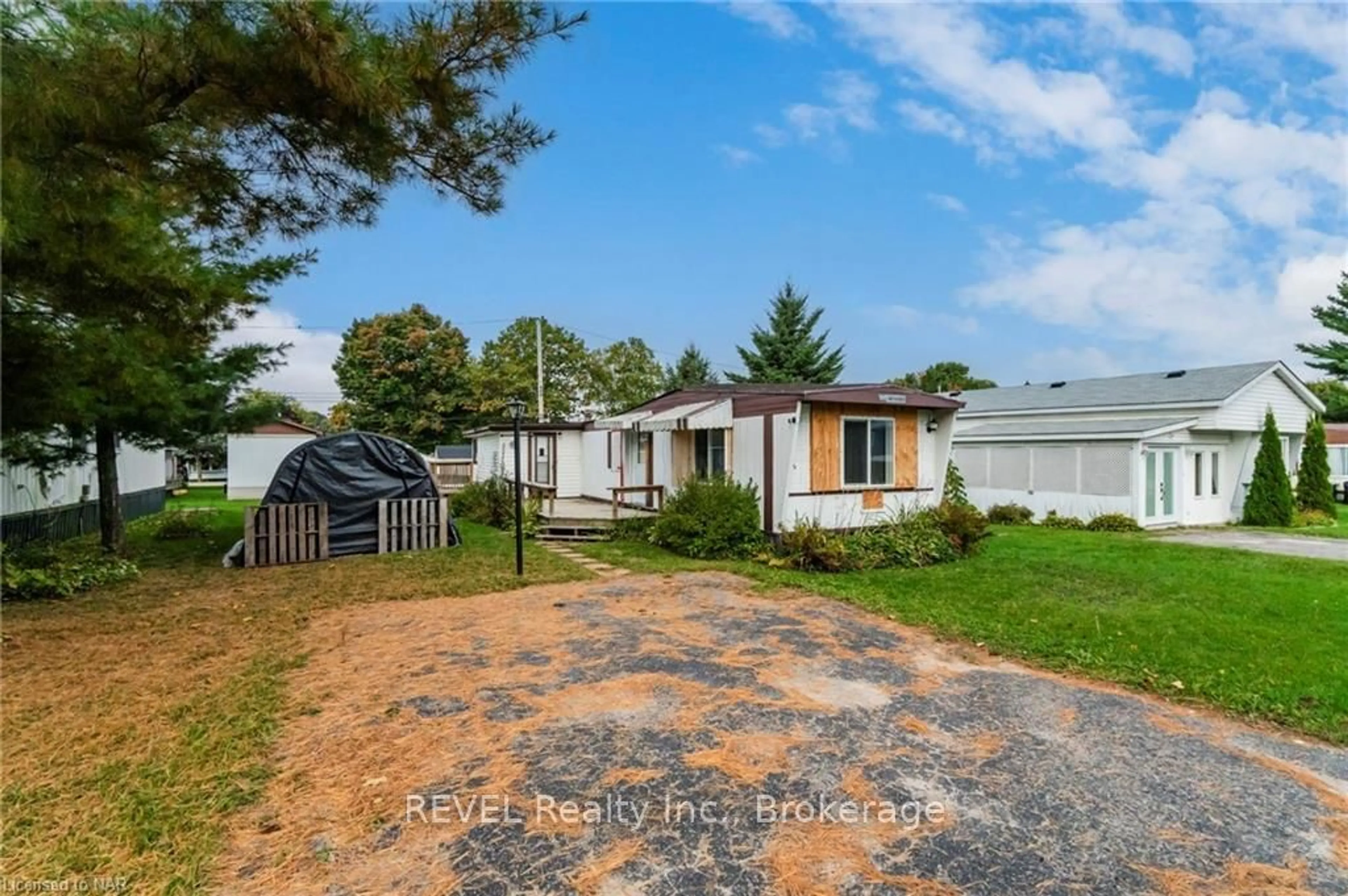 Frontside or backside of a home, the fenced backyard for 12 MAPLE Lane, Midland Ontario L4R 0B9