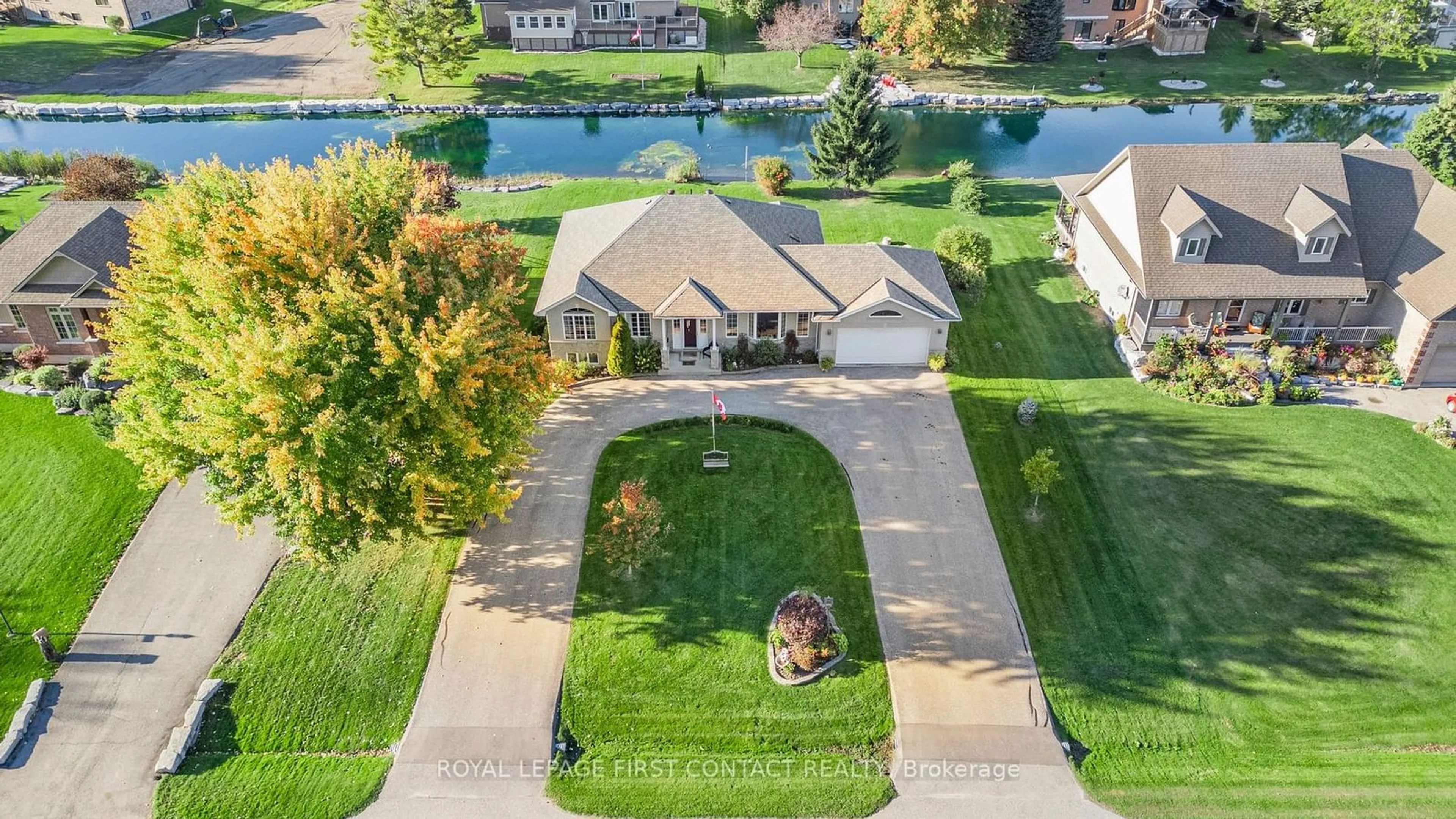 Frontside or backside of a home, the fenced backyard for 93 Bayshore Dr, Ramara Ontario L0K 1B0