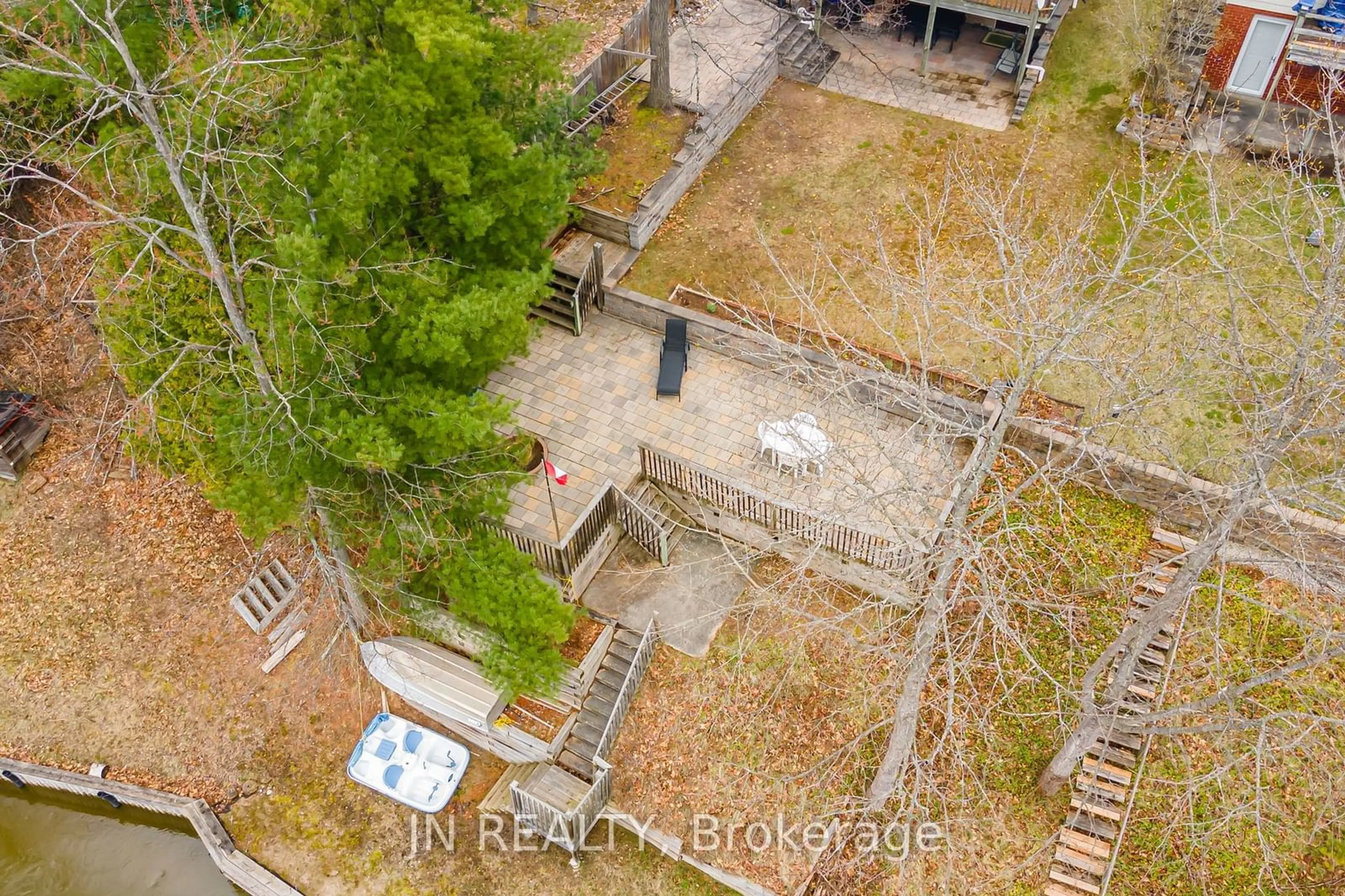 Frontside or backside of a home, the fenced backyard for 322 Oxbow Park Dr, Wasaga Beach Ontario L9Z 2V6