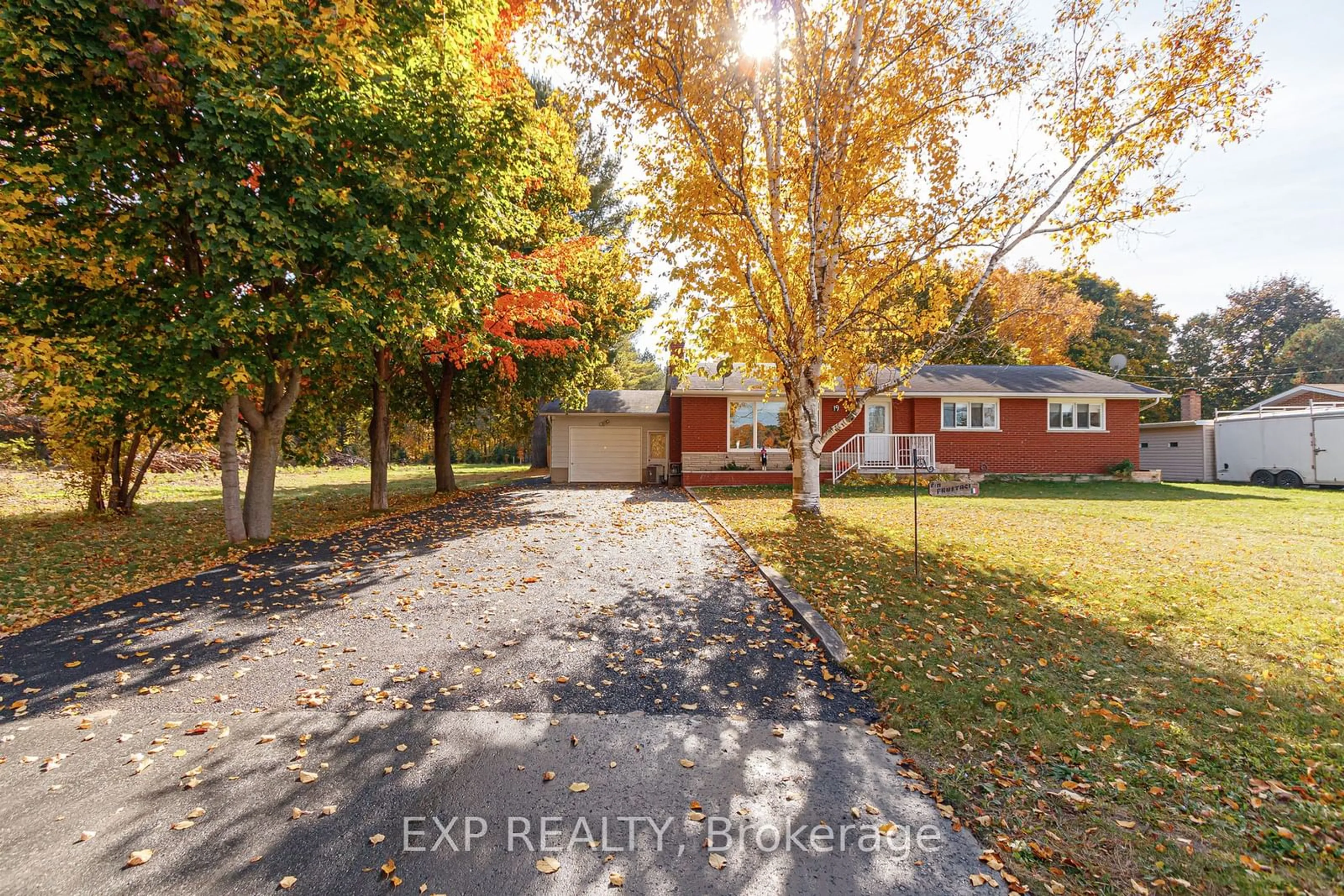 Frontside or backside of a home, the fenced backyard for 19 Locke Ave, Clearview Ontario L0M 1S0