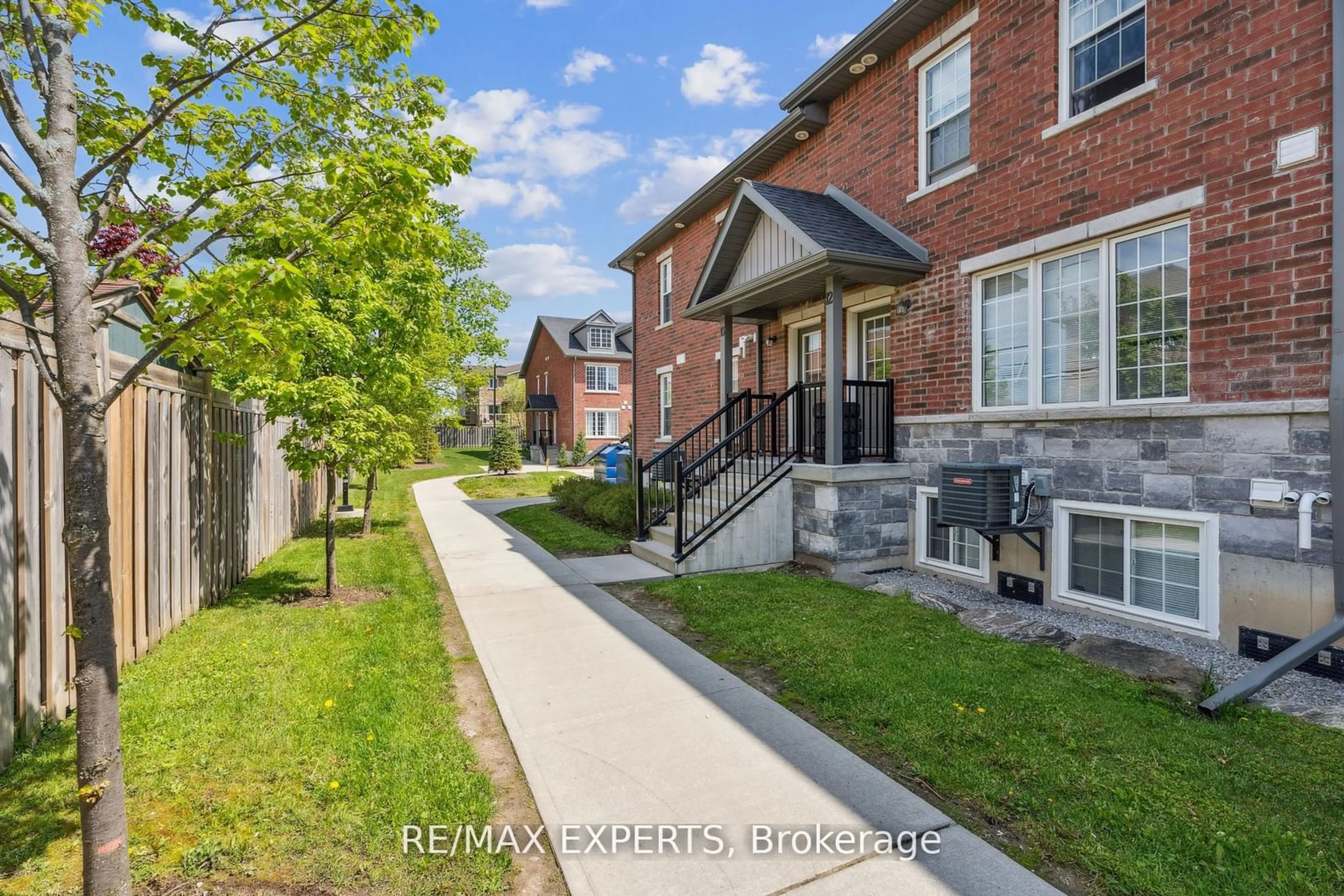 A pic from exterior of the house or condo, the fenced backyard for 246 Penetanguishene Rd #13, Barrie Ontario L4M 7C2