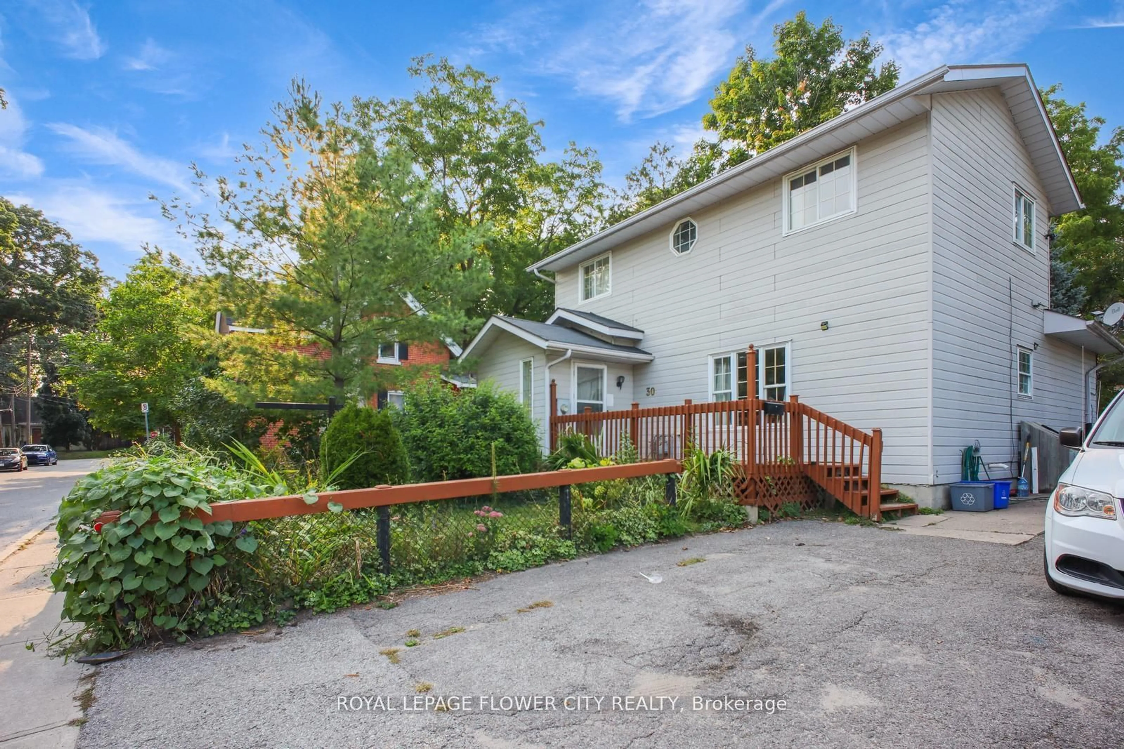 A pic from exterior of the house or condo, the fenced backyard for 30 North St, Barrie Ontario L4M 2R9