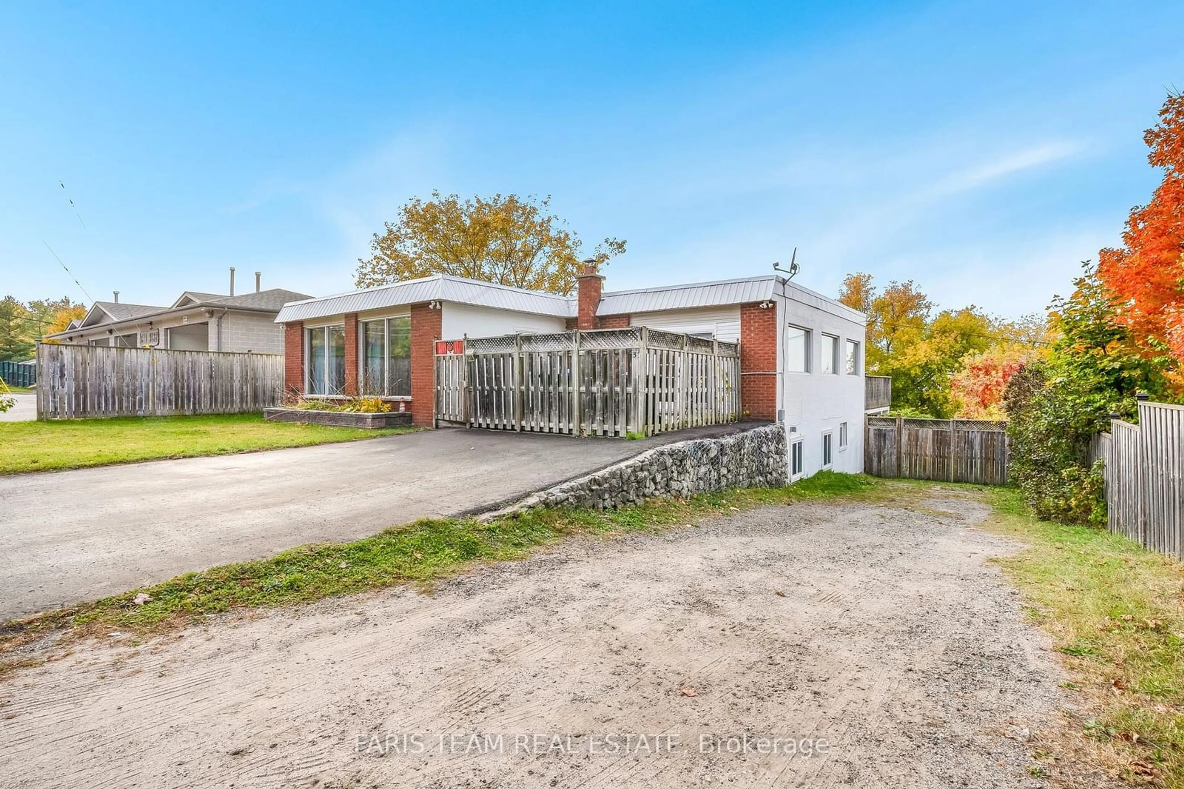 Frontside or backside of a home, the fenced backyard for 138 Richard St, Tay Ontario L0K 2A0