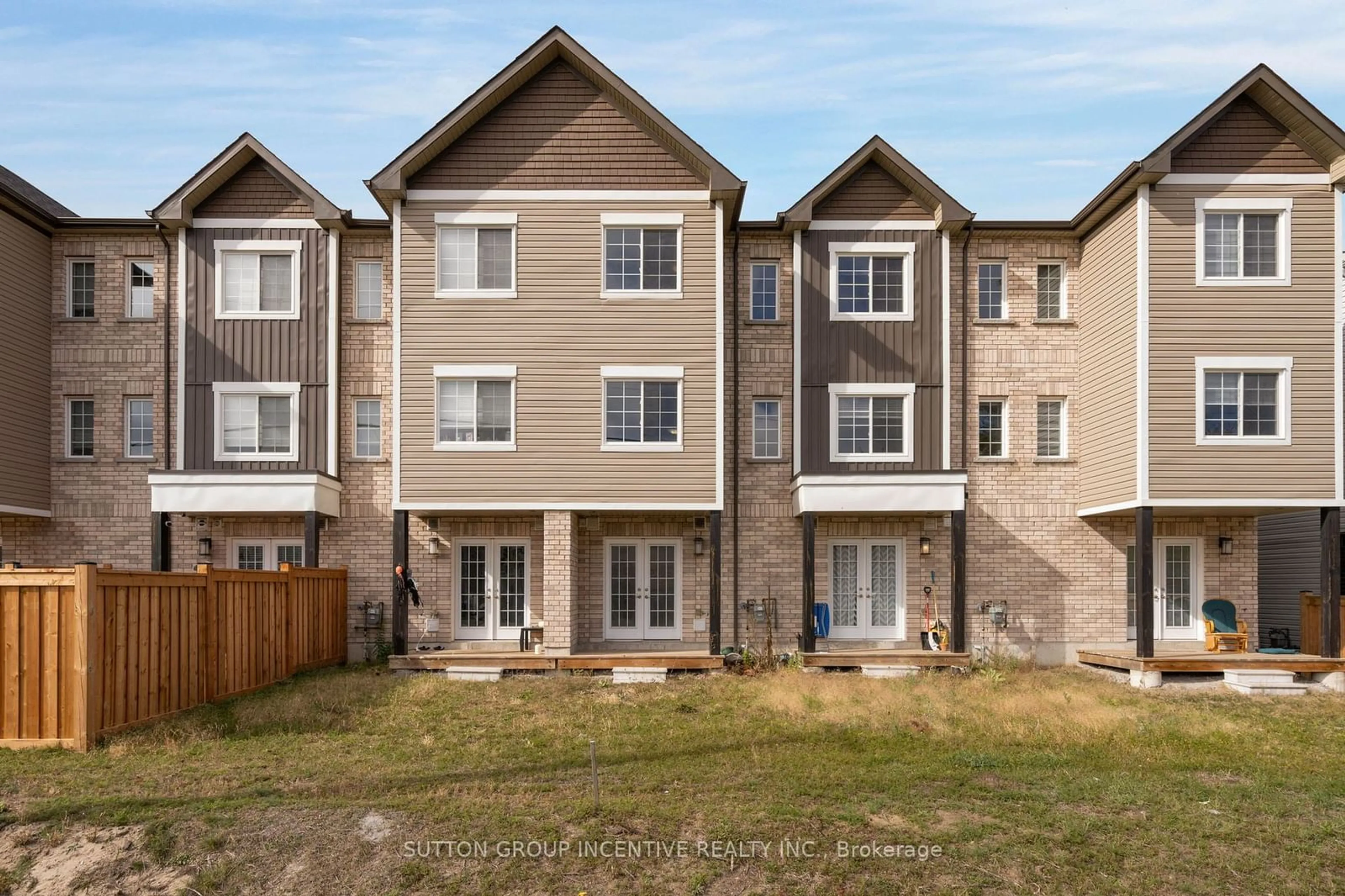 A pic from exterior of the house or condo, the fenced backyard for 53 Andean Lane, Barrie Ontario L9J 0B1