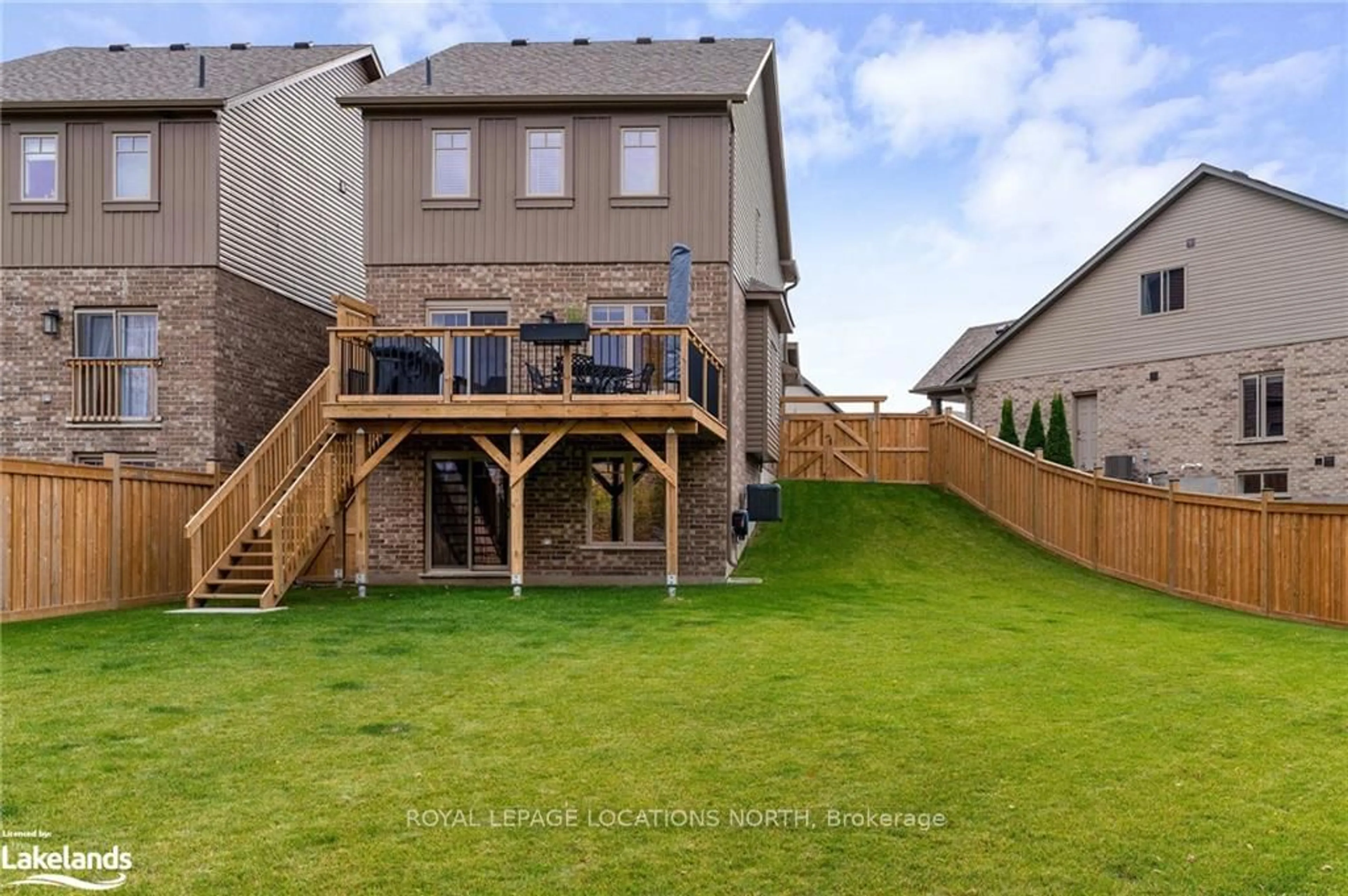 Frontside or backside of a home, the fenced backyard for 24 Foley Cres, Collingwood Ontario L9Y 3B7