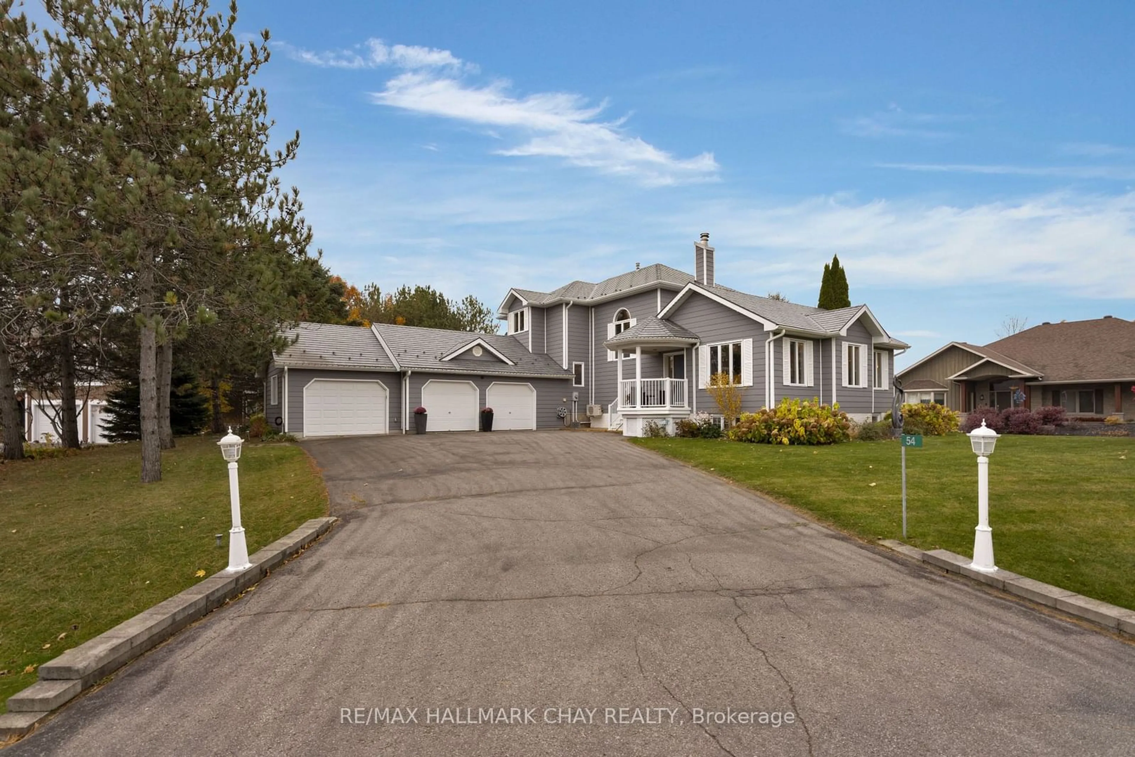 Frontside or backside of a home, the street view for 54 Highland Dr, Oro-Medonte Ontario L0L 2L0