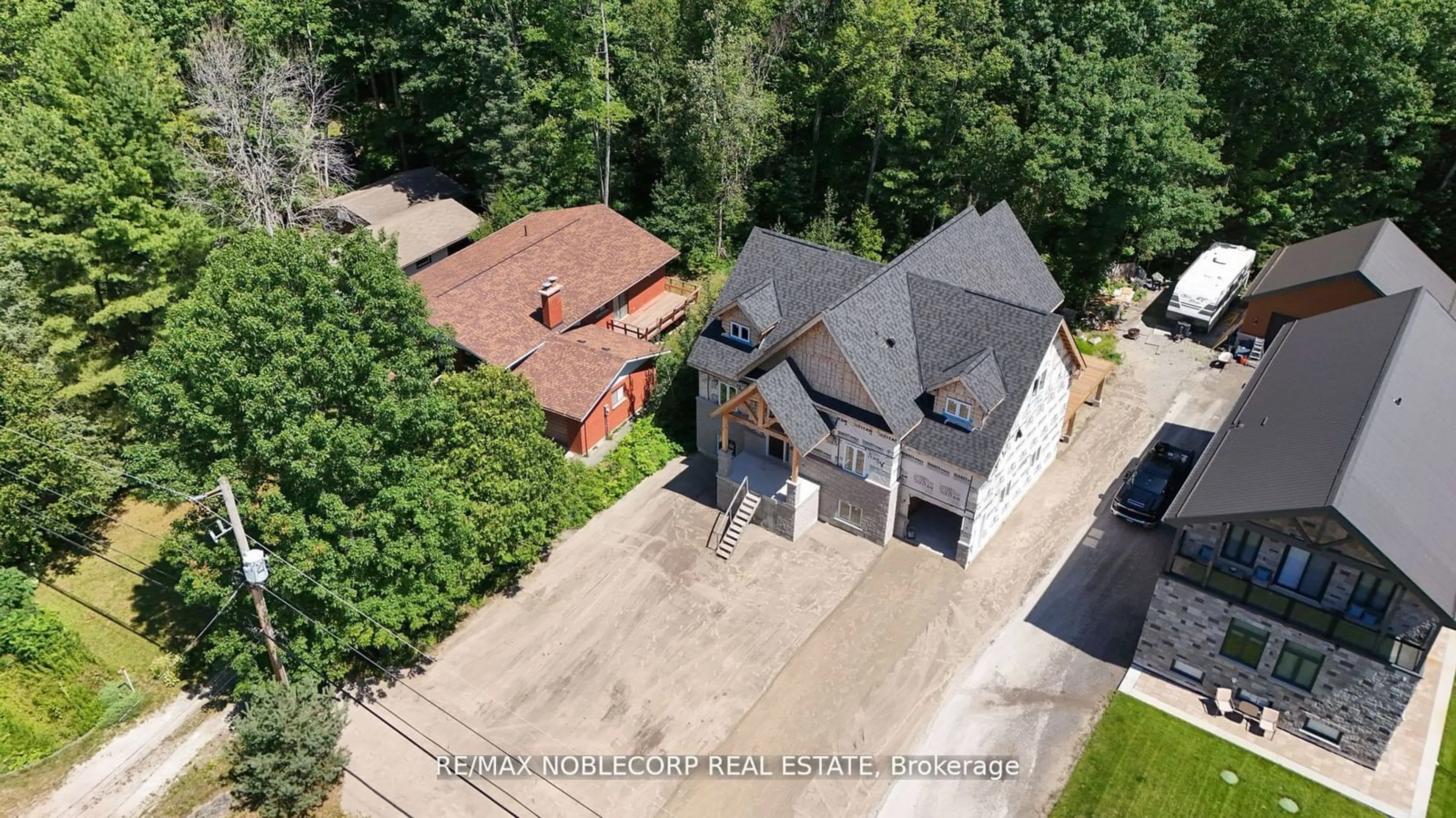 Frontside or backside of a home, cottage for 403 Tiny Beaches Rd, Tiny Ontario L0L 2J0