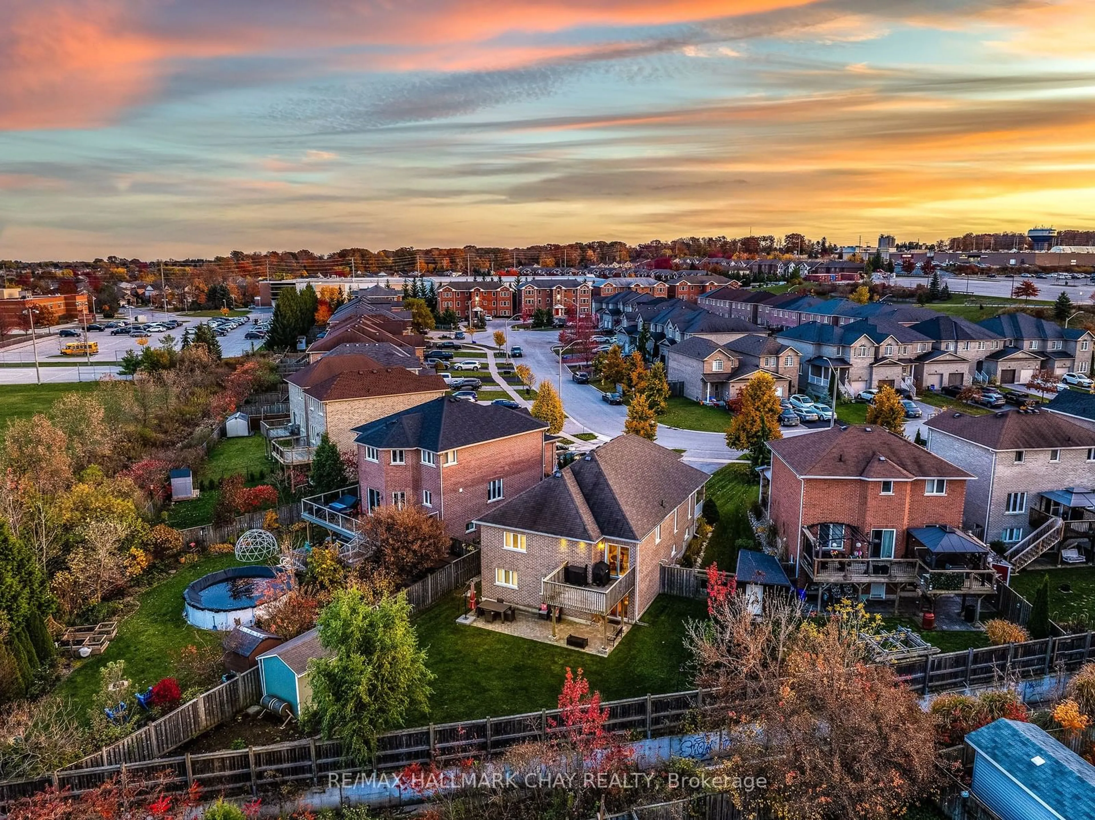 A pic from exterior of the house or condo, the fenced backyard for 14 Arch Brown Crt, Barrie Ontario L4M 0C6