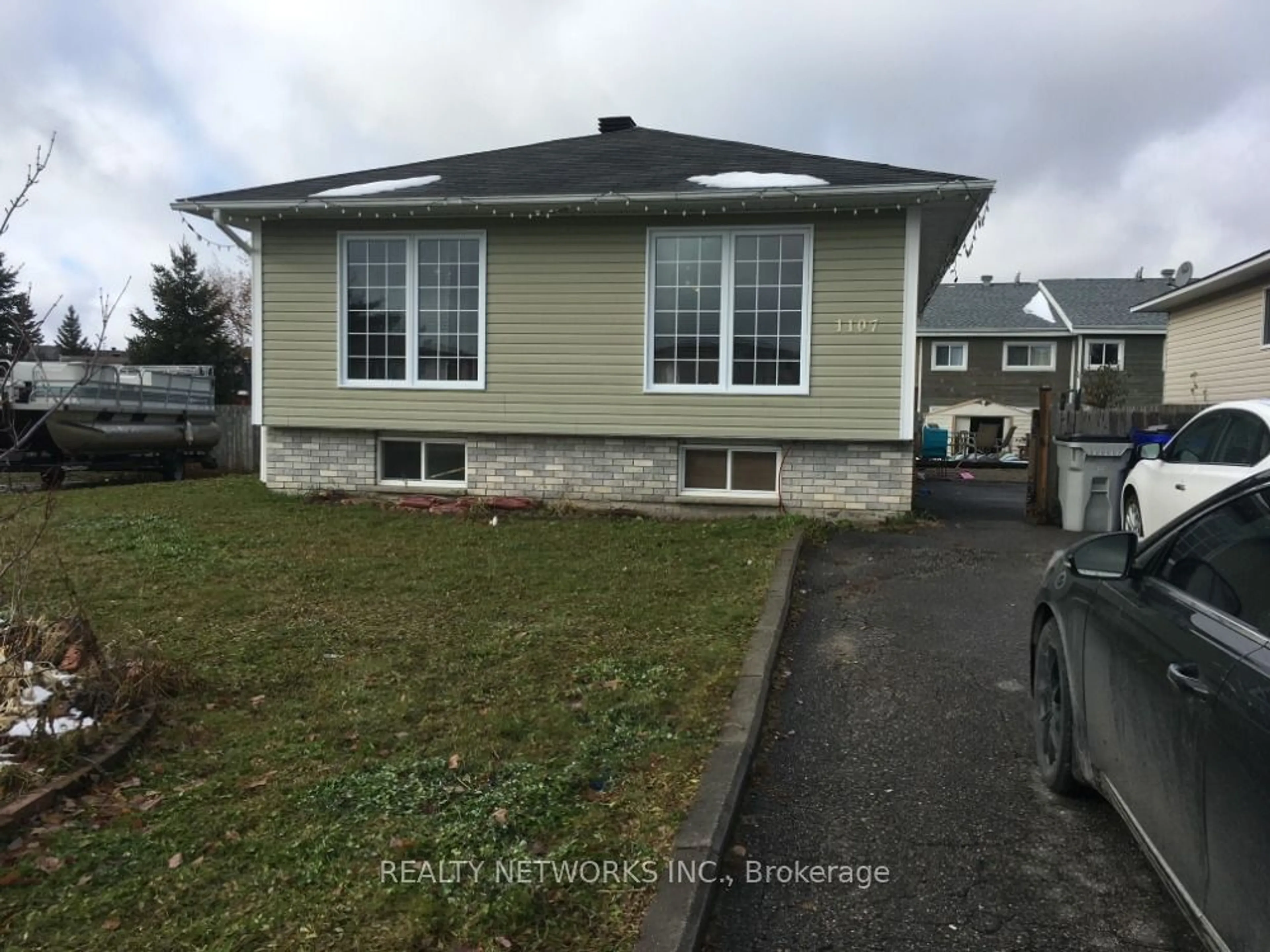 Frontside or backside of a home, the street view for 1107 Lozanne Cres, Timmins Ontario P4P 1H2