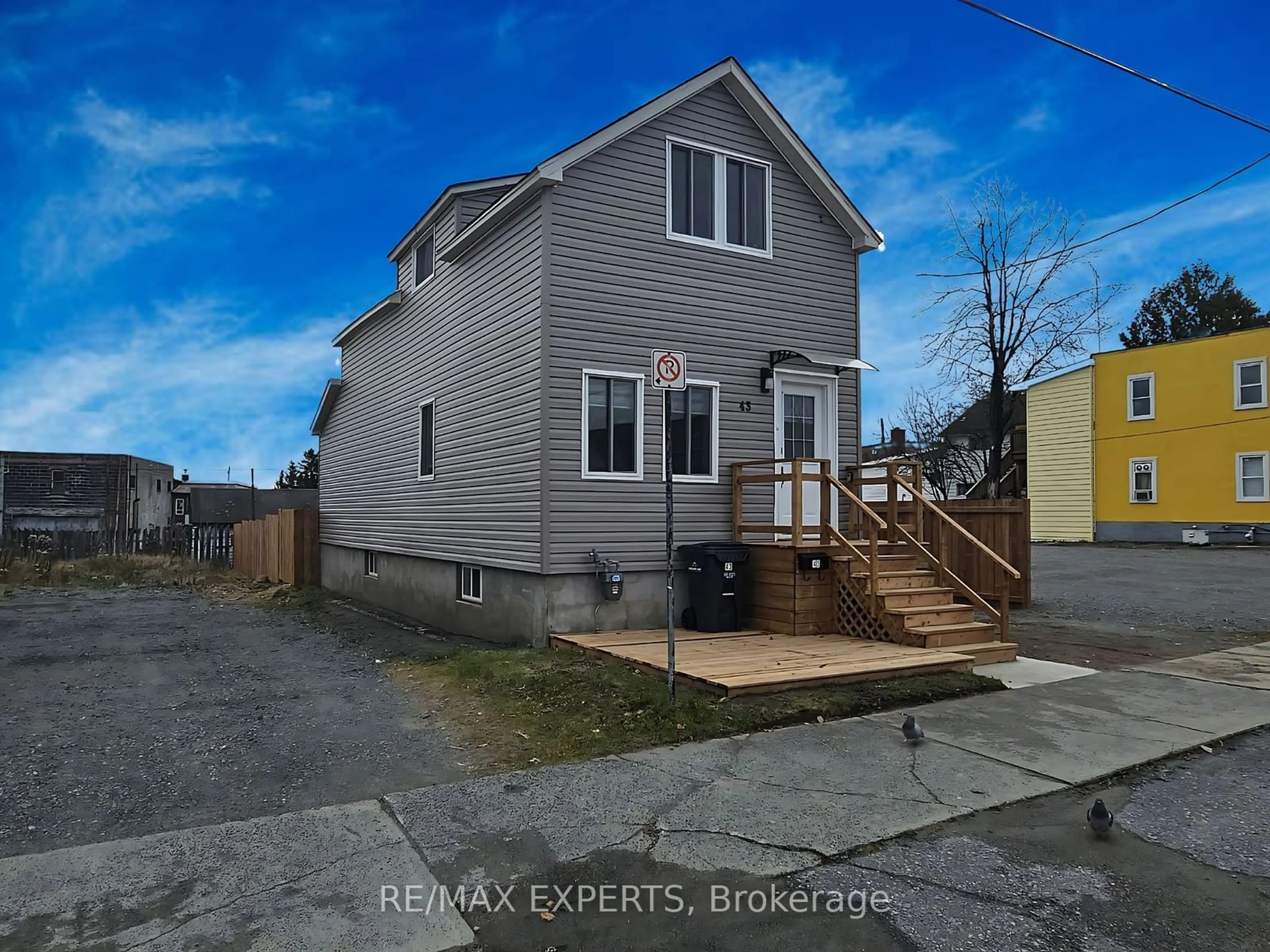 Frontside or backside of a home, the fenced backyard for 43 Kirkpatrick St, Kirkland Lake Ontario P2N 2H2