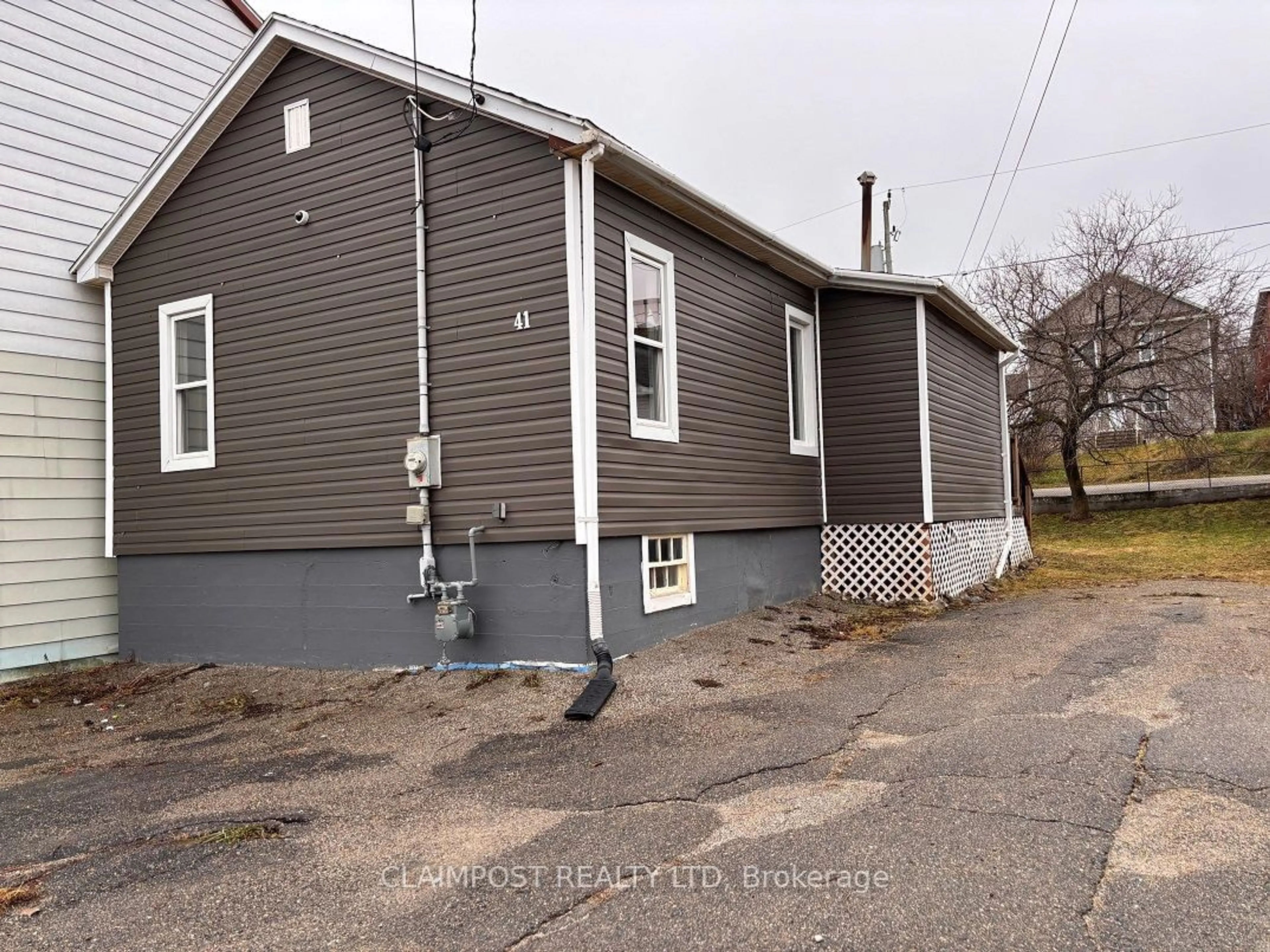 Frontside or backside of a home, the front or back of building for 41 Dwyer Ave, Timmins Ontario P0N 1G0