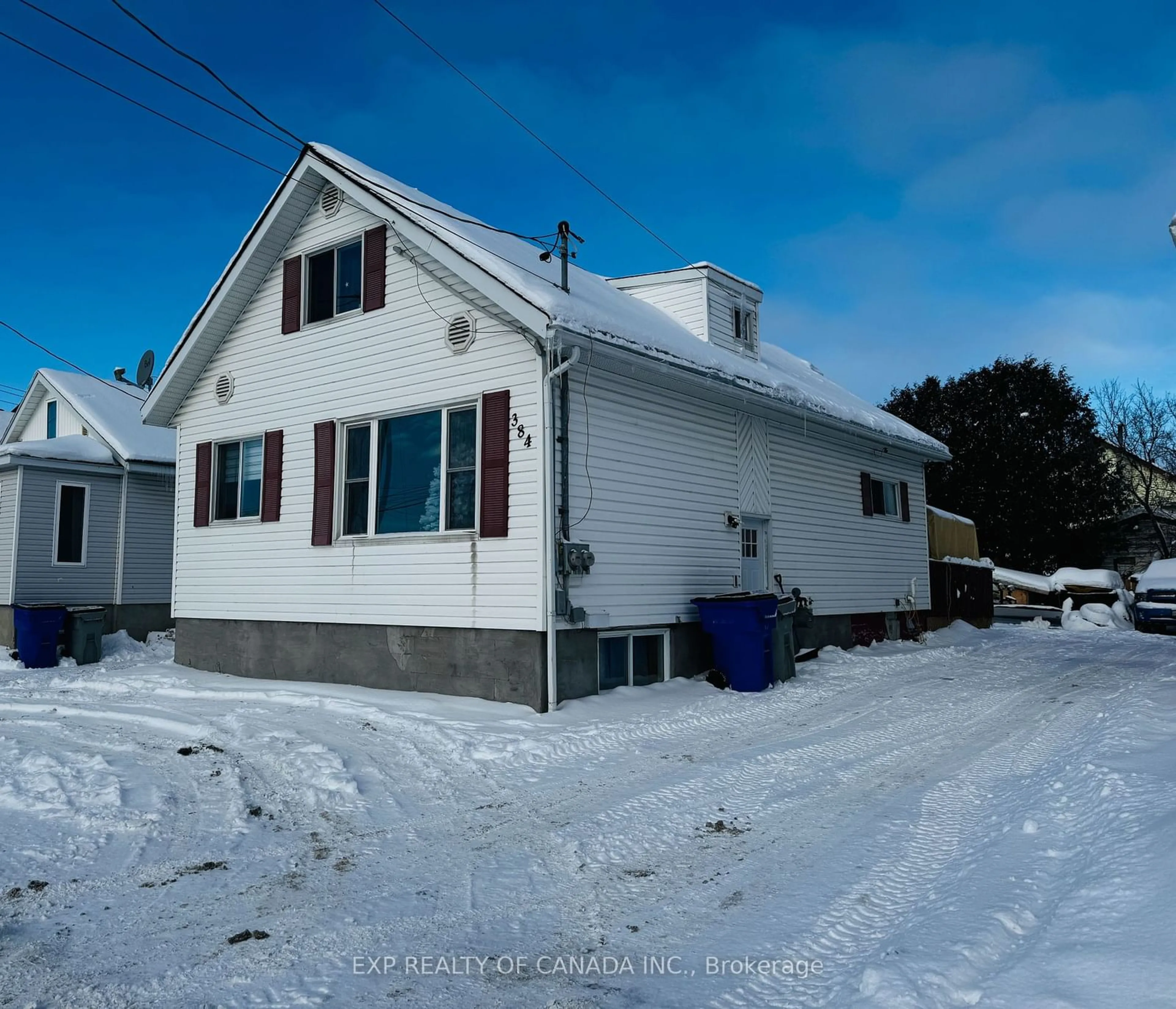 A pic from outside/outdoor area/front of a property/back of a property/a pic from drone, street for 384 Commercial Ave, Timmins Ontario P4N 2X9